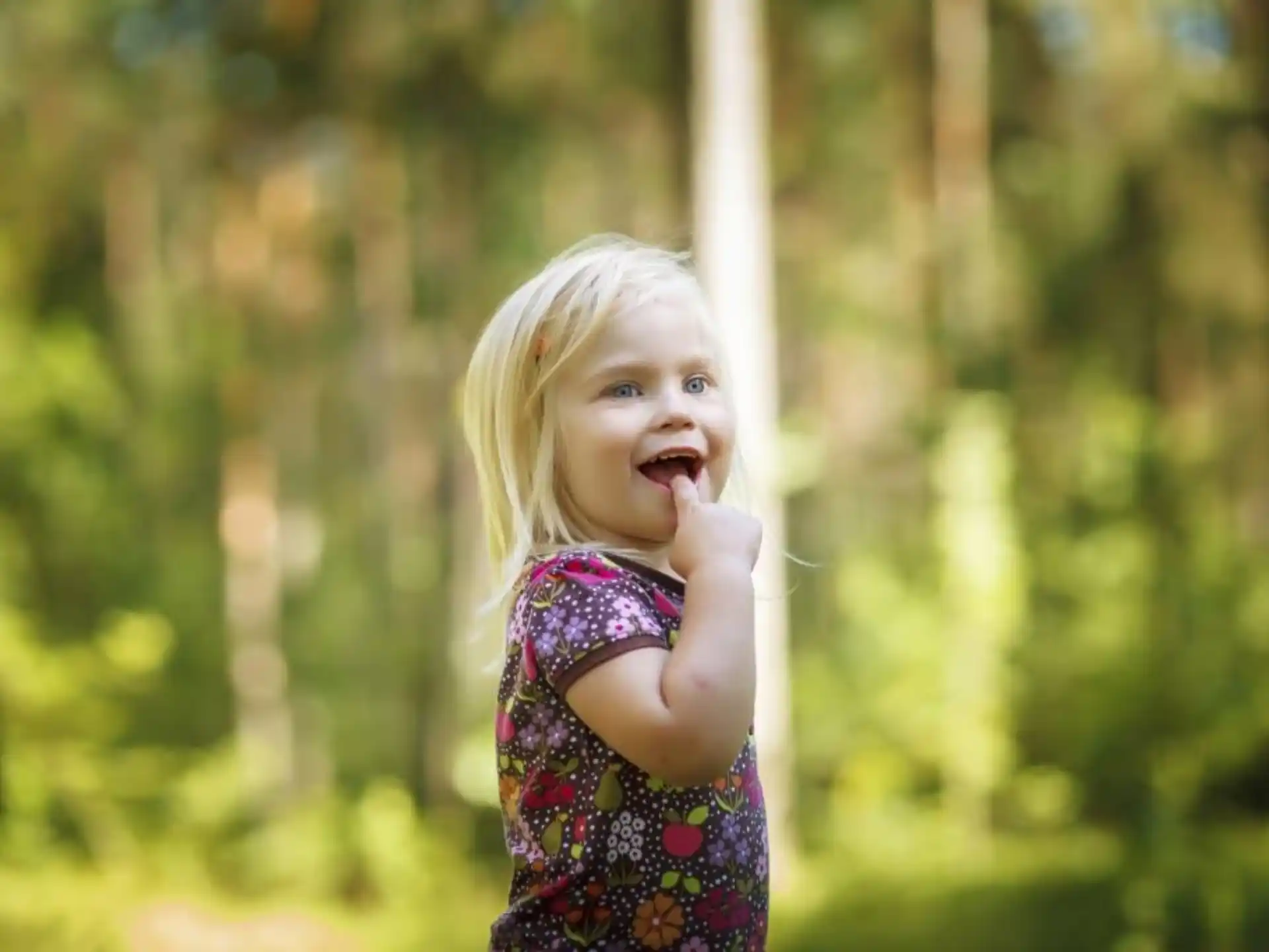a little girl holding a stick