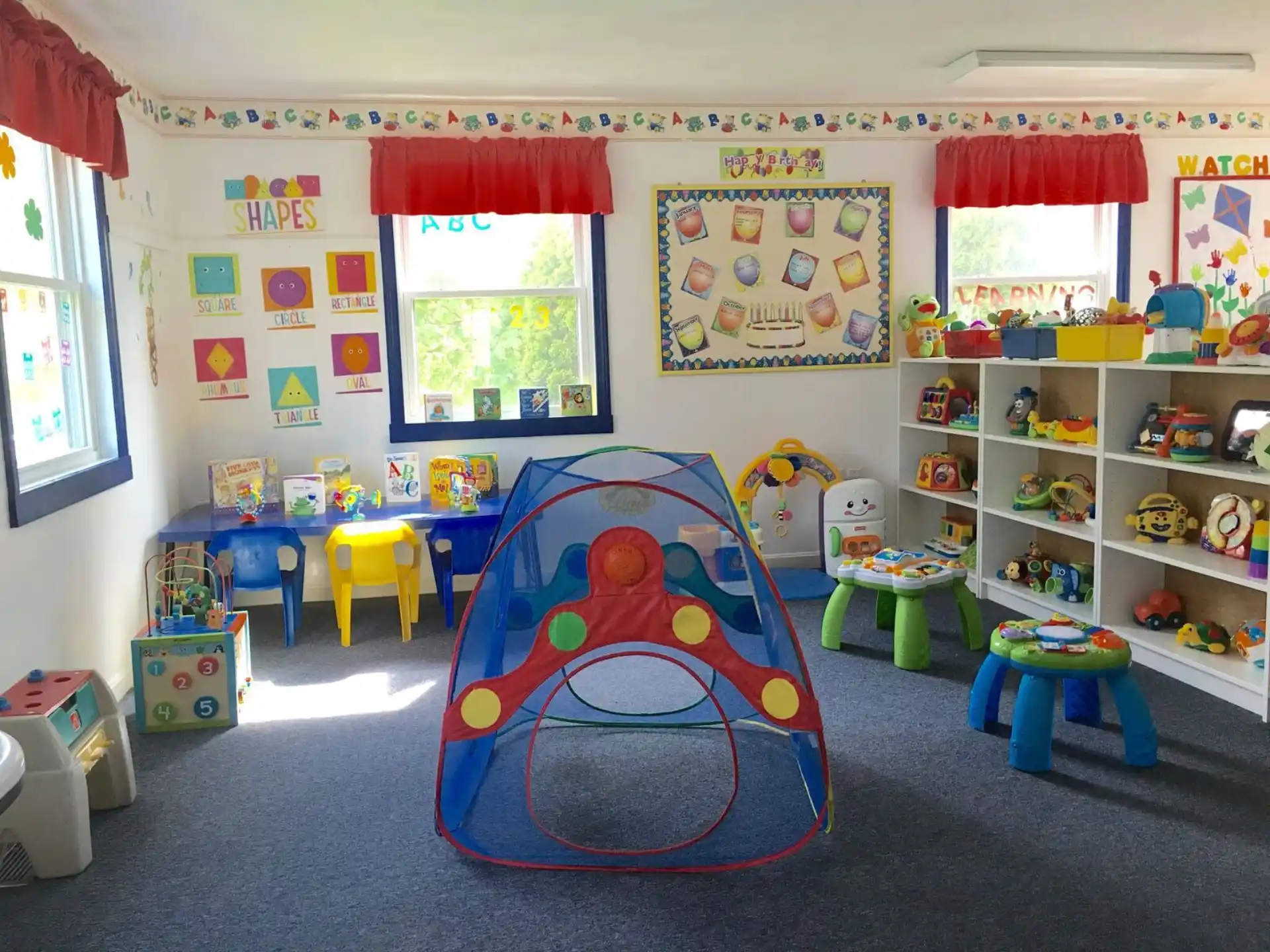 a room with colorful chairs and toys