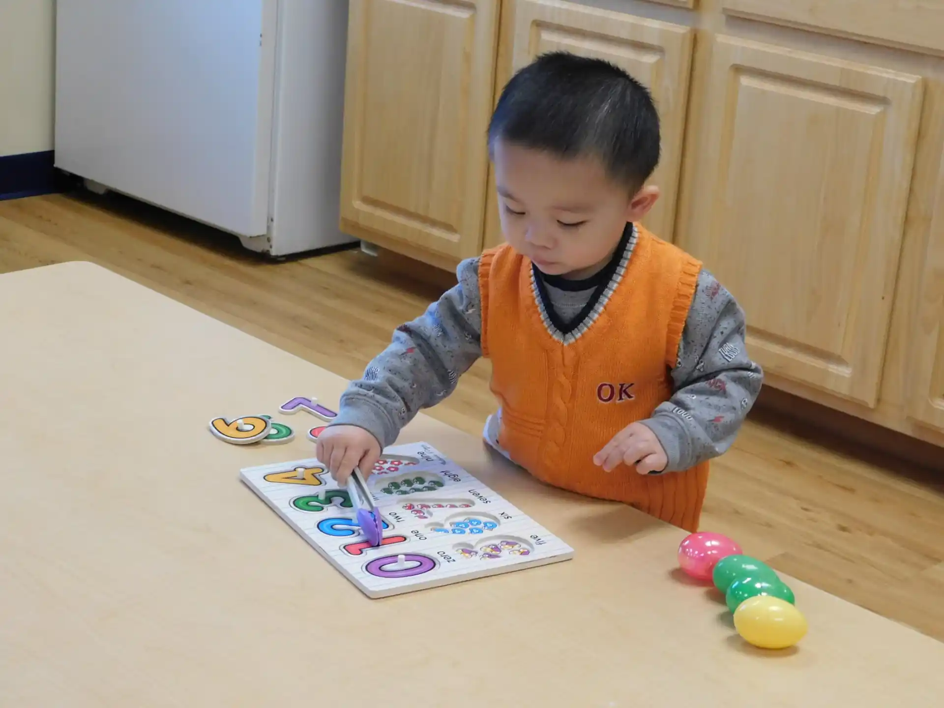 a baby coloring on a paper