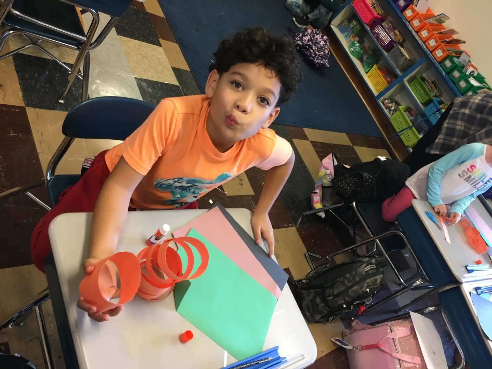 a boy sitting at a table
