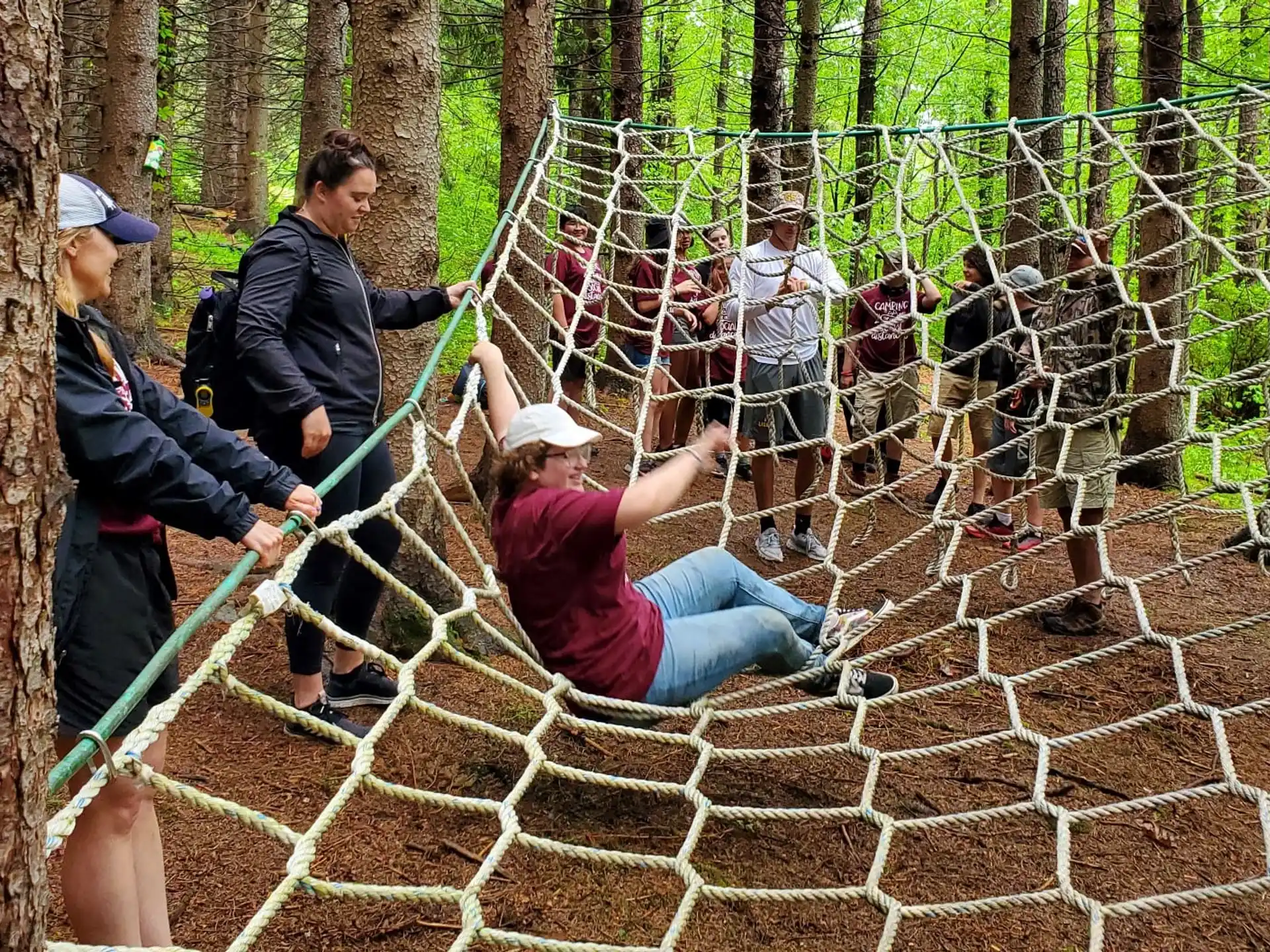 a group of people in a cage