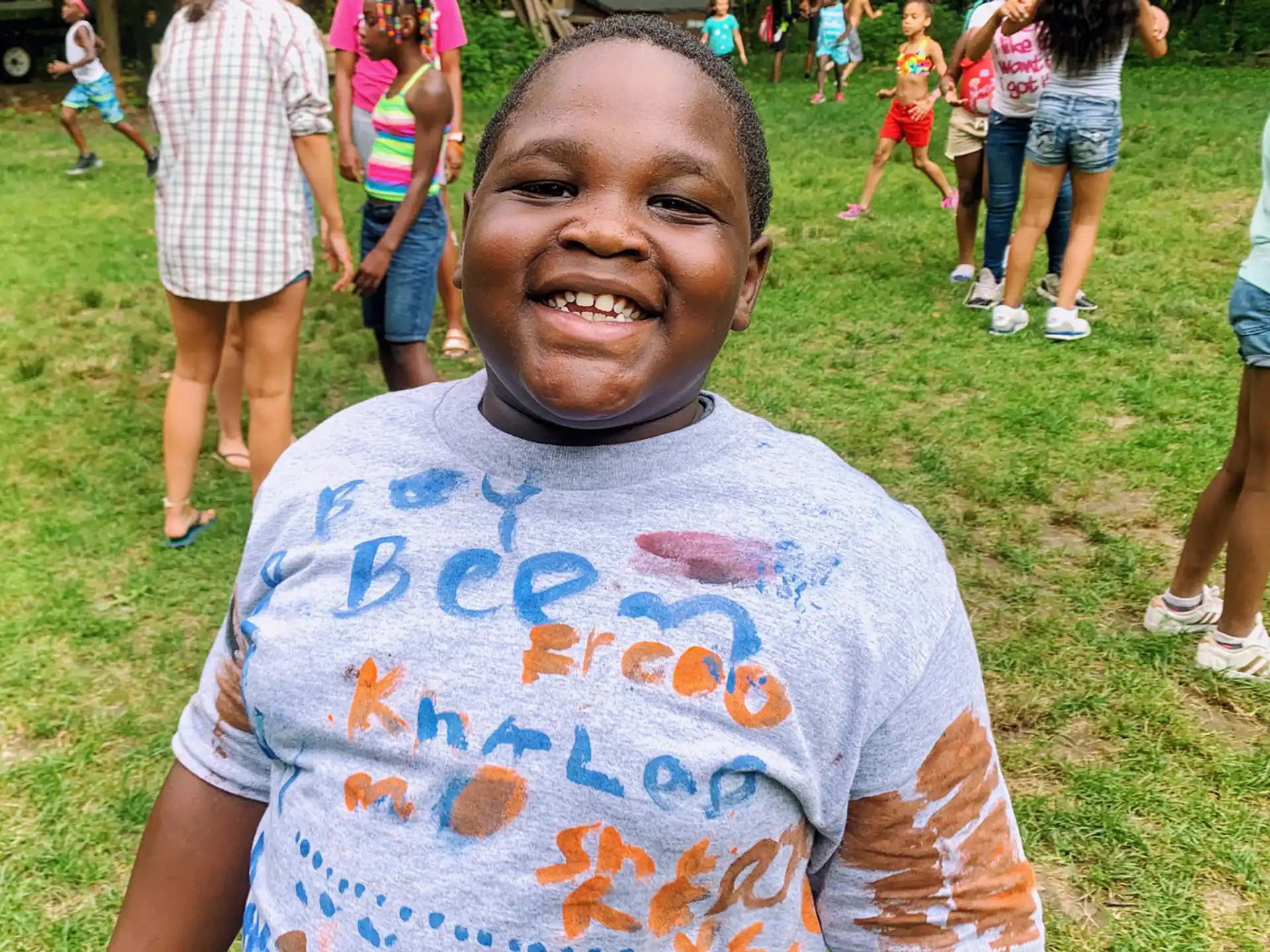 a boy holding a sign