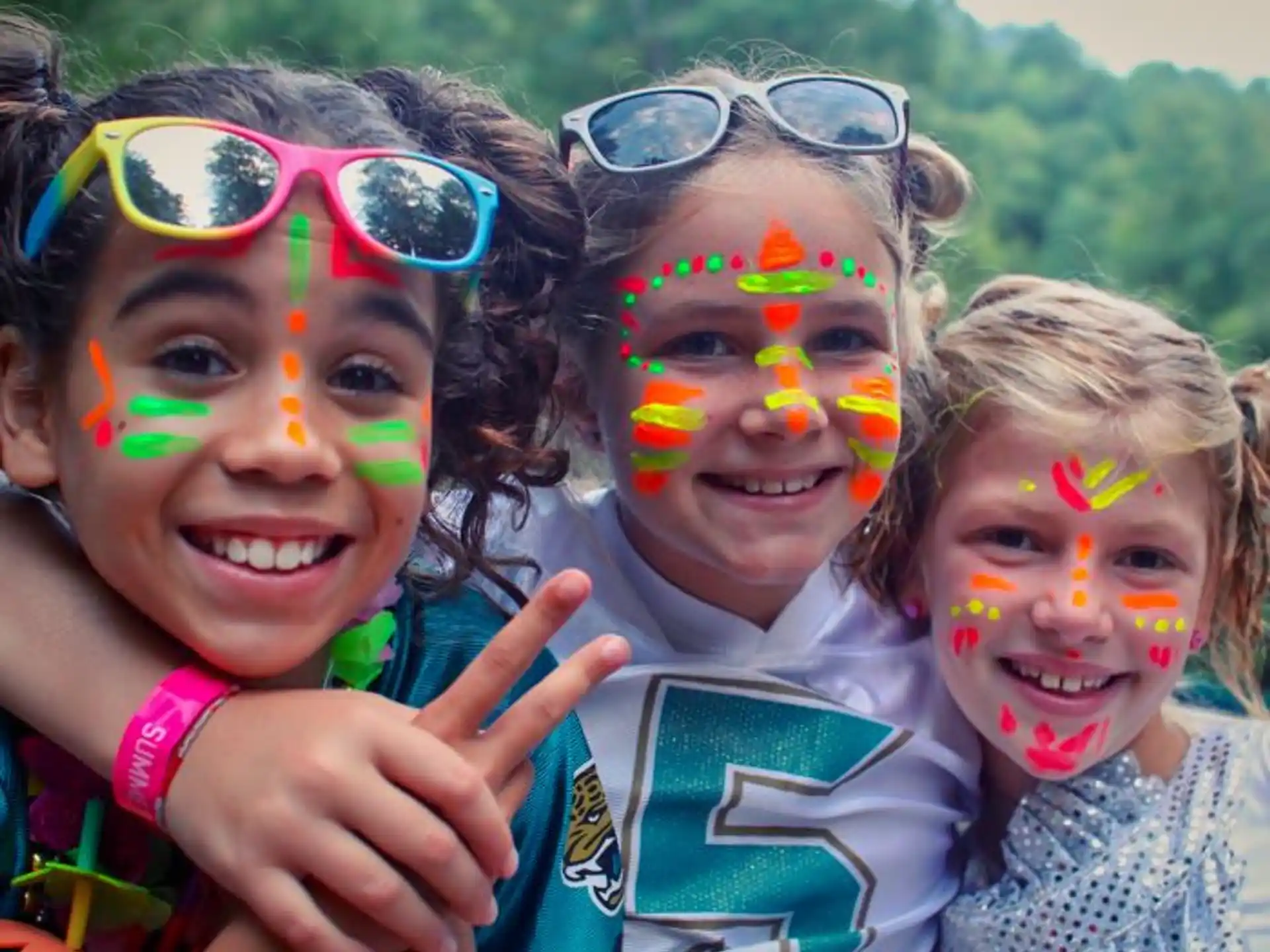 a group of children with painted faces