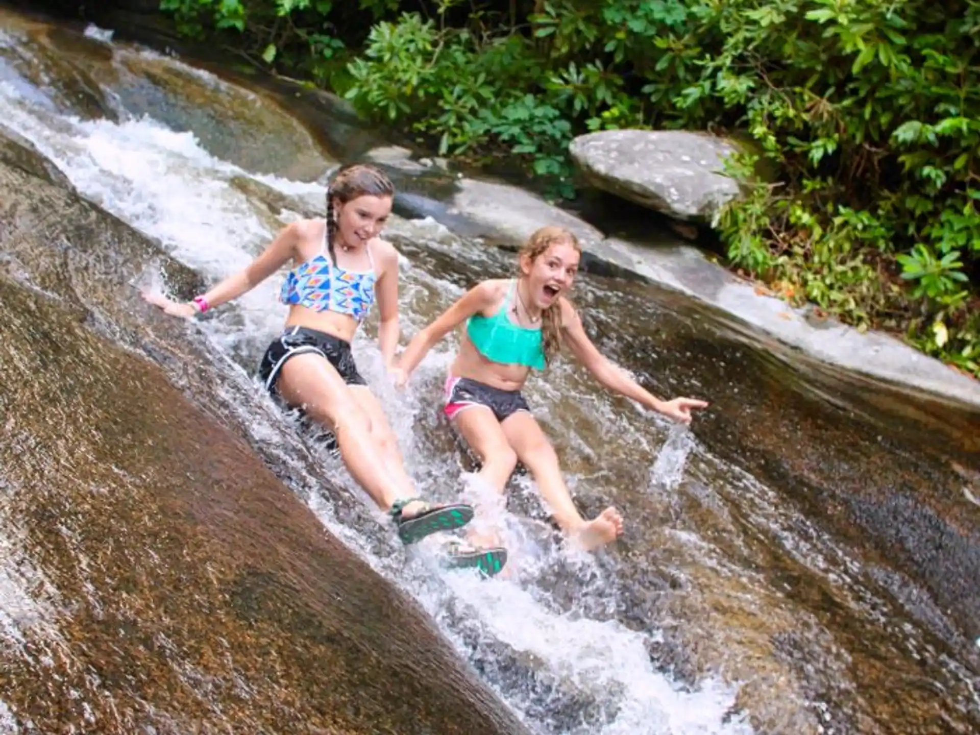 two girls in a river