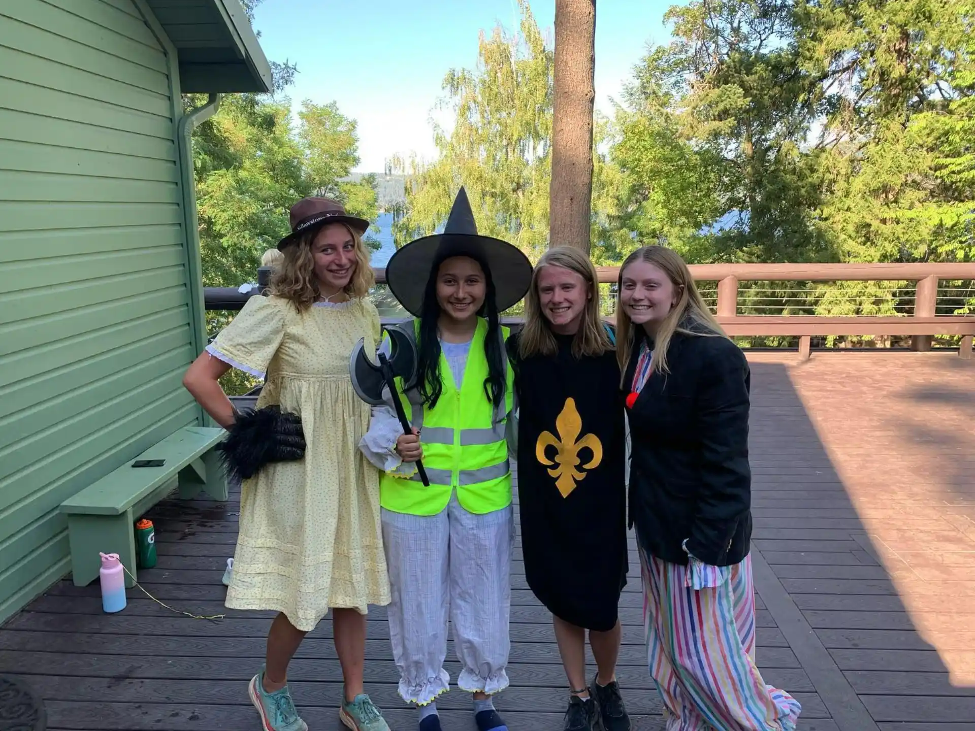 a group of women posing for a photo outside