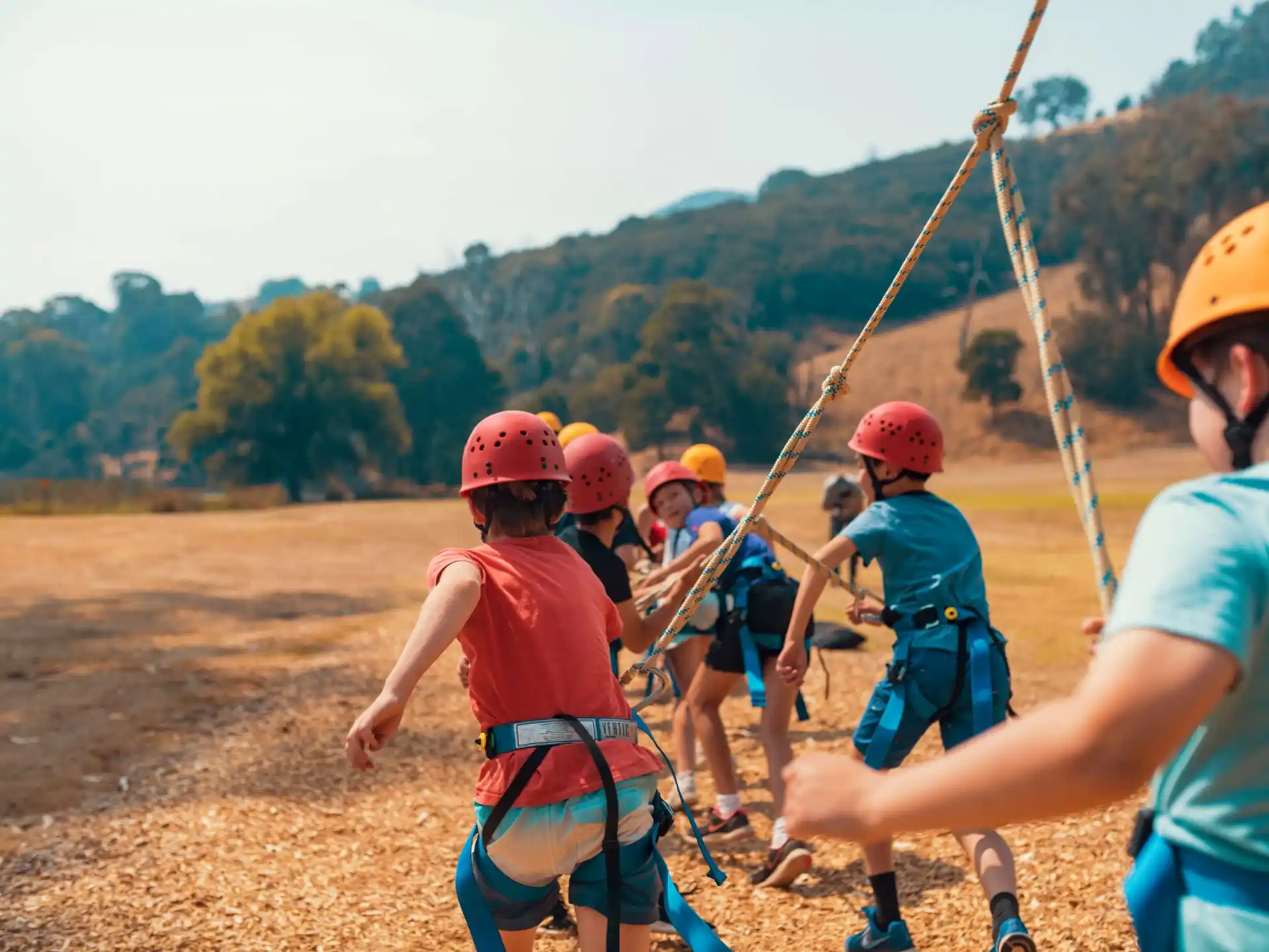 a group of people wearing helmets and harnesses