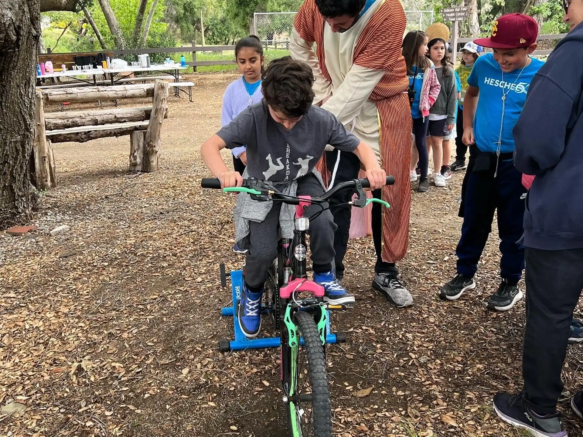 a group of people around a bicycle