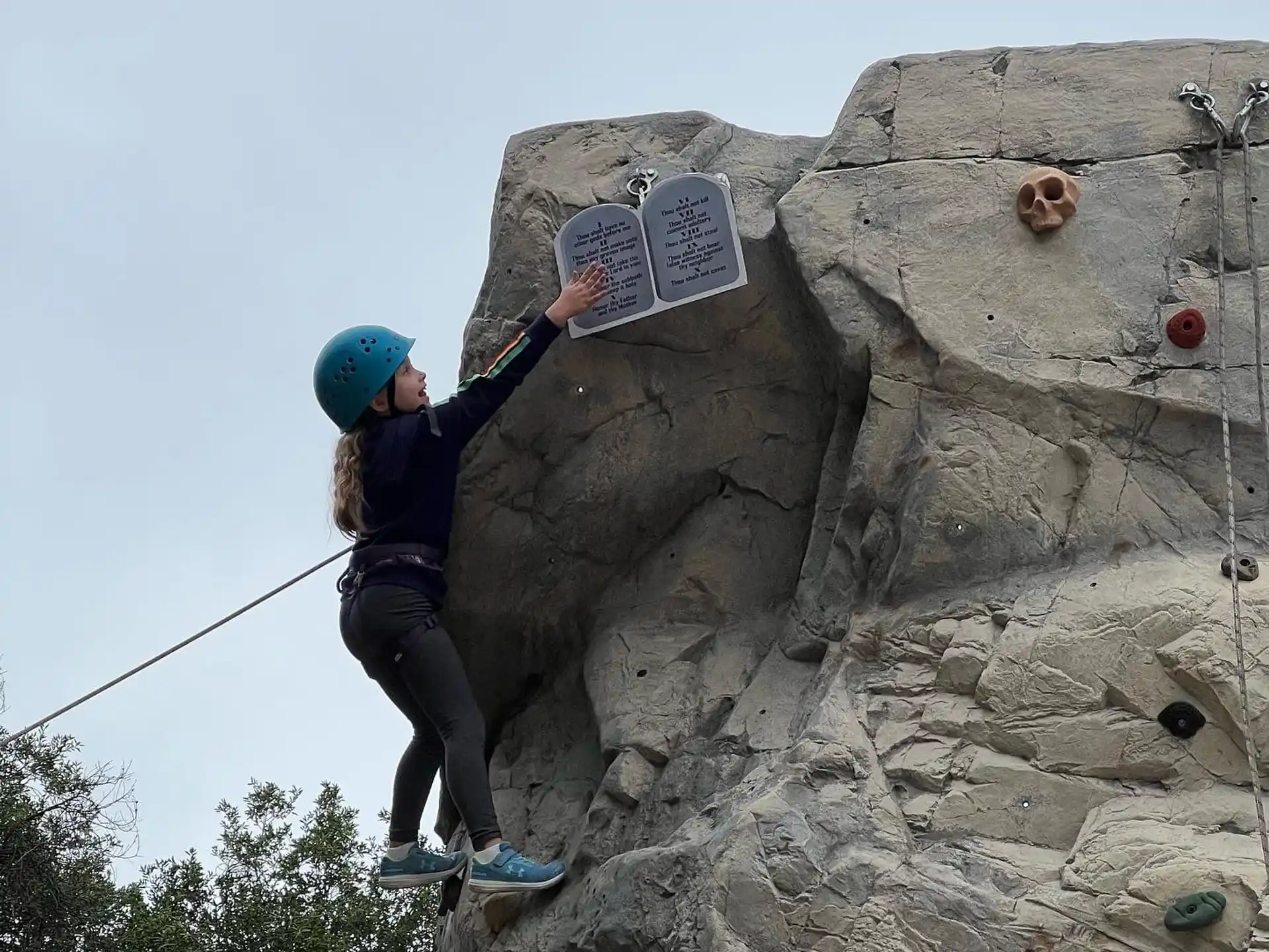 a man climbing a rock