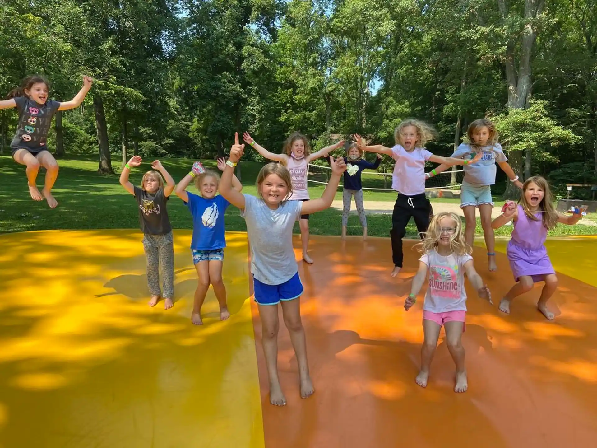 a group of children jumping in the air