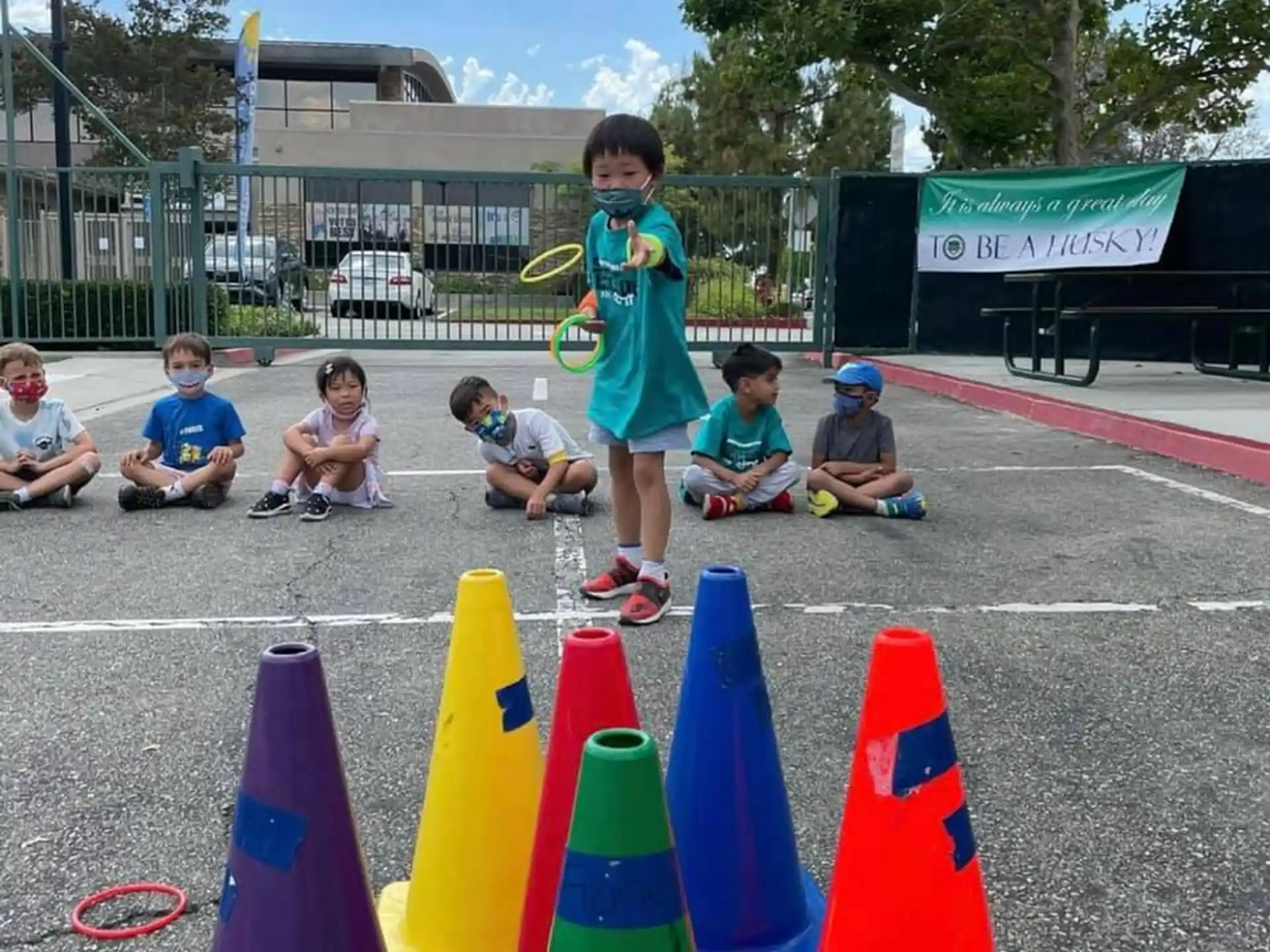 a girl standing between several cones