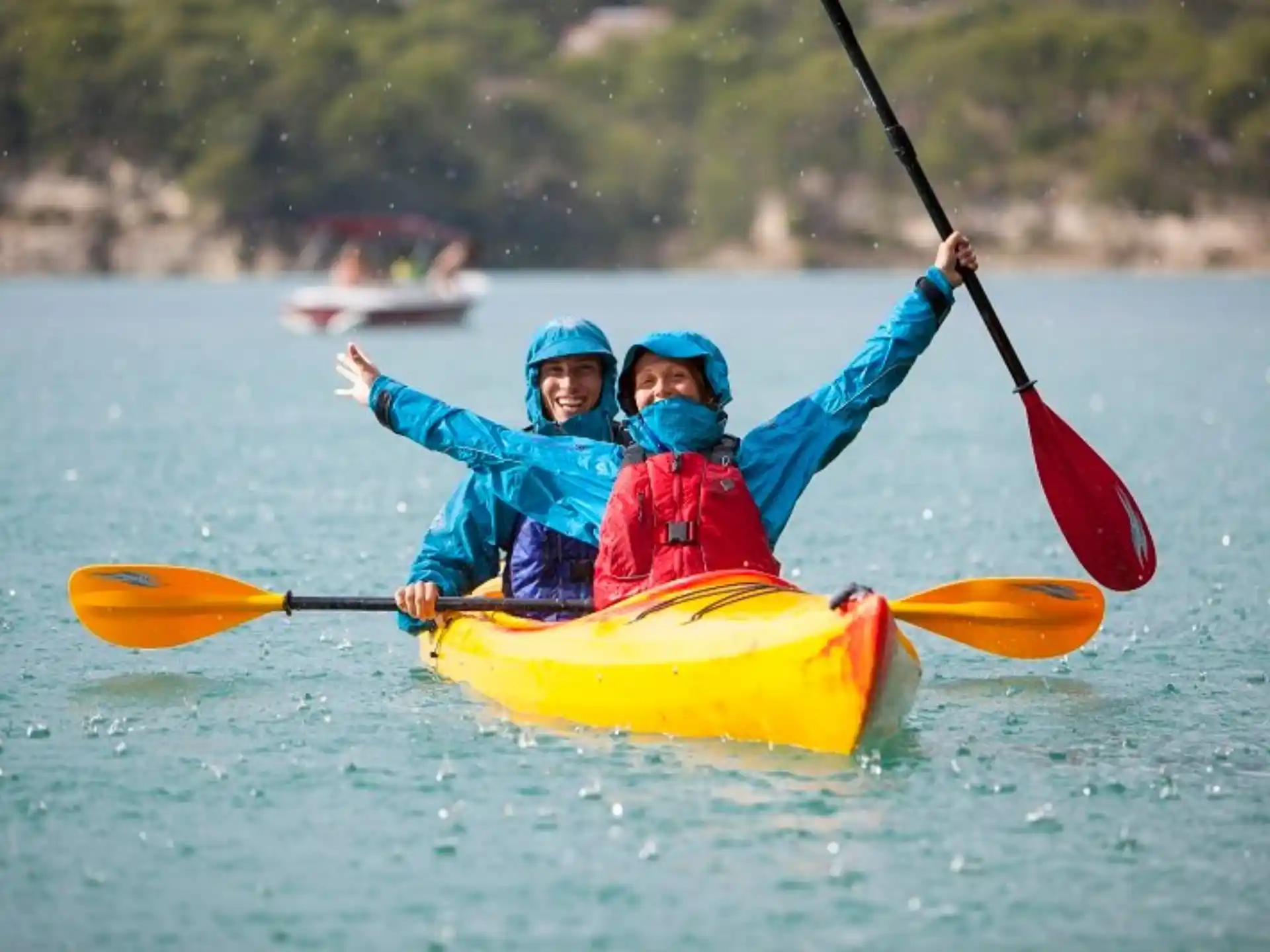 two kids in kayaks