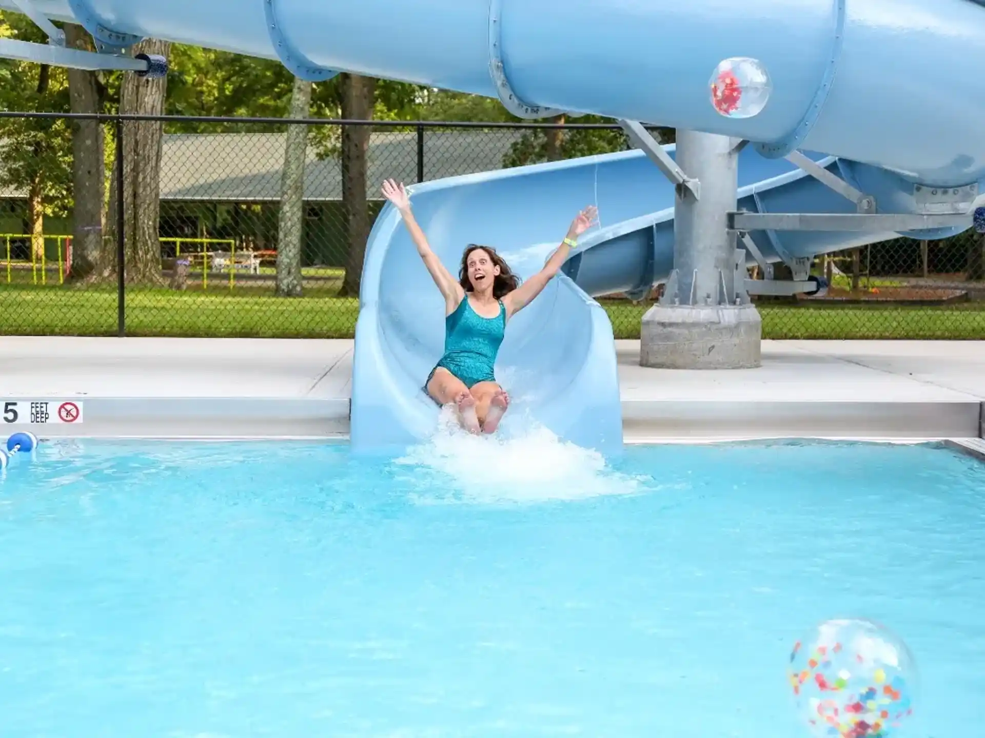 a person jumping into a pool