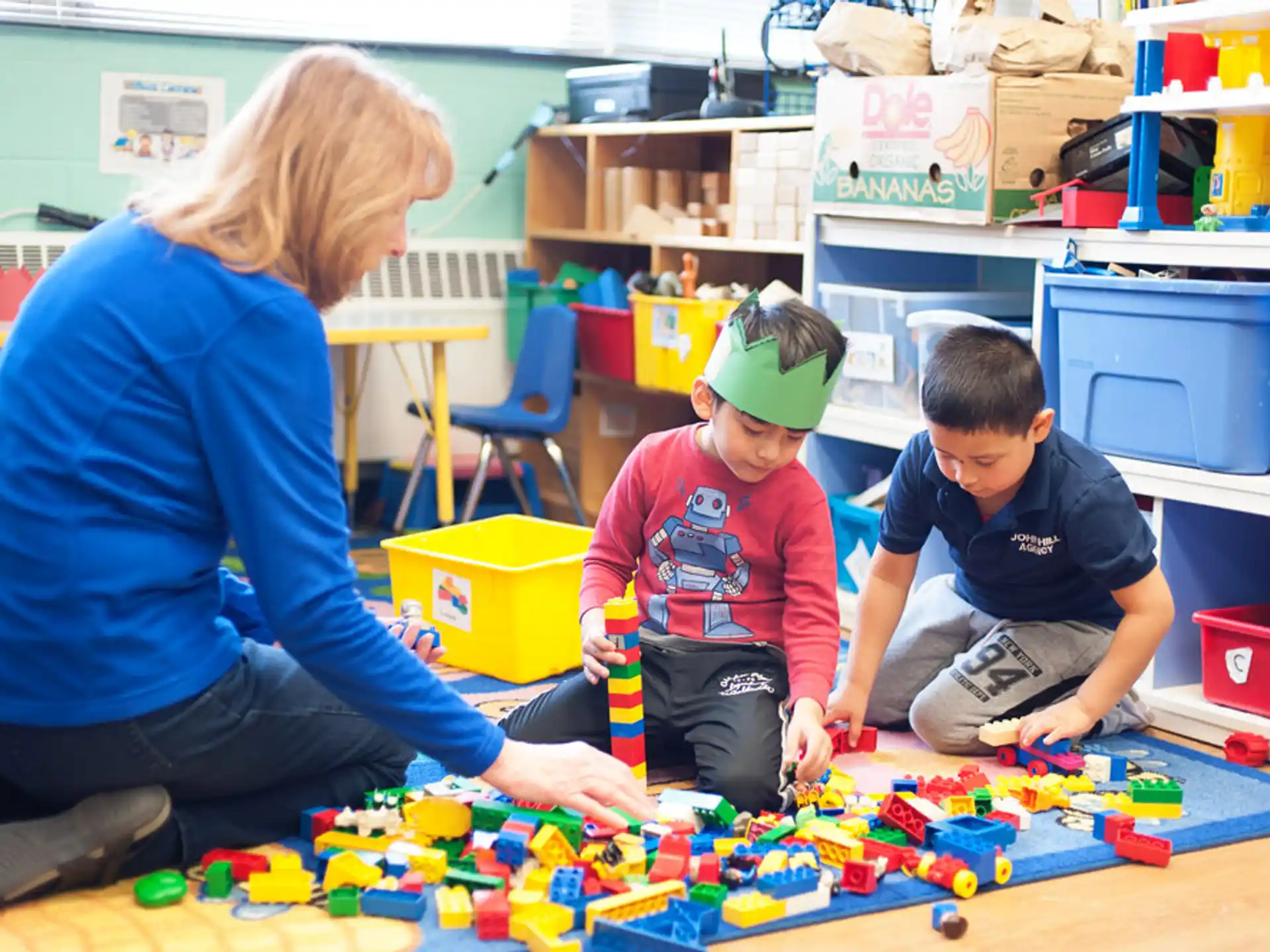 a person and kids playing with toys
