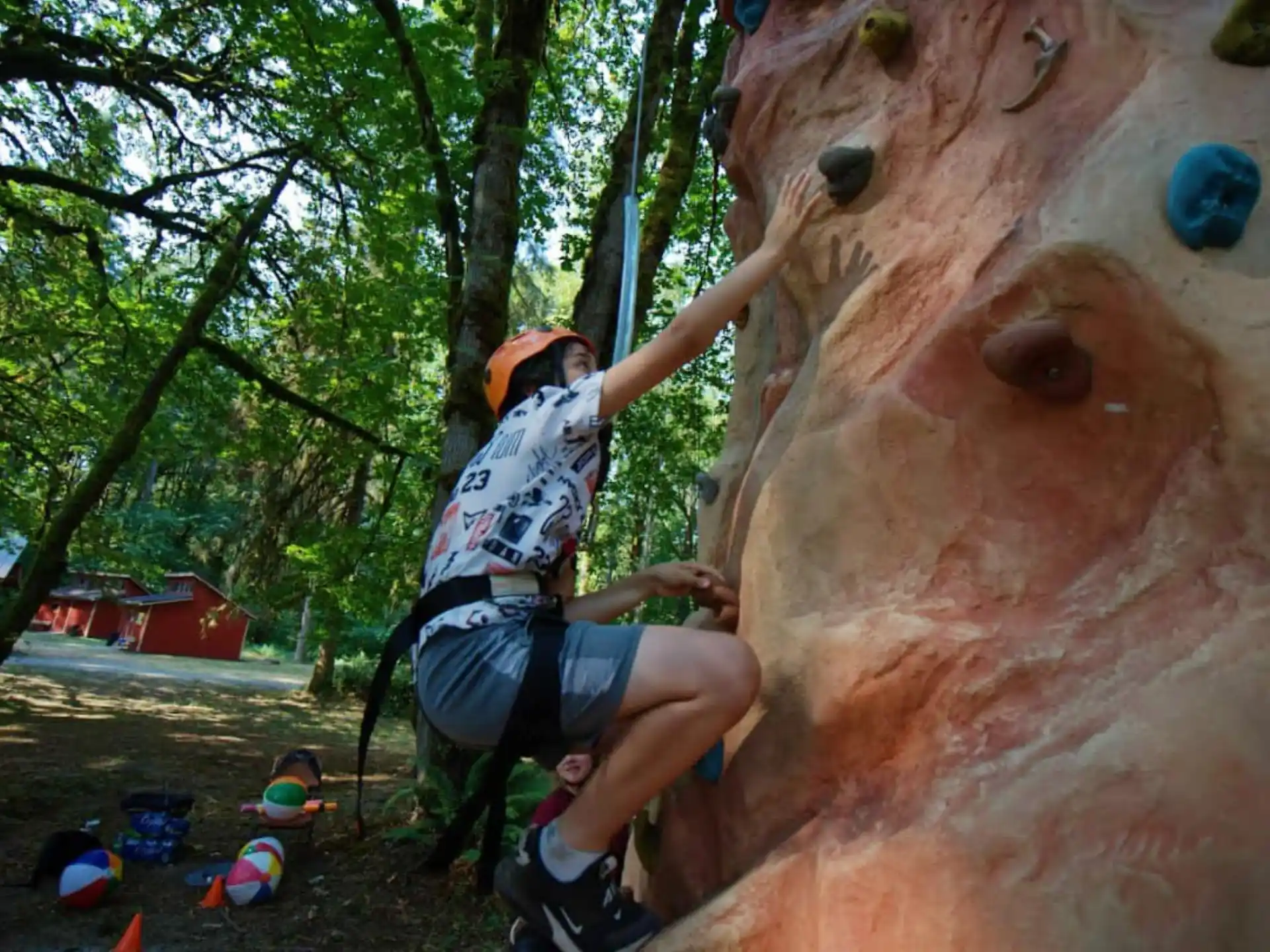 a man climbing a large rock