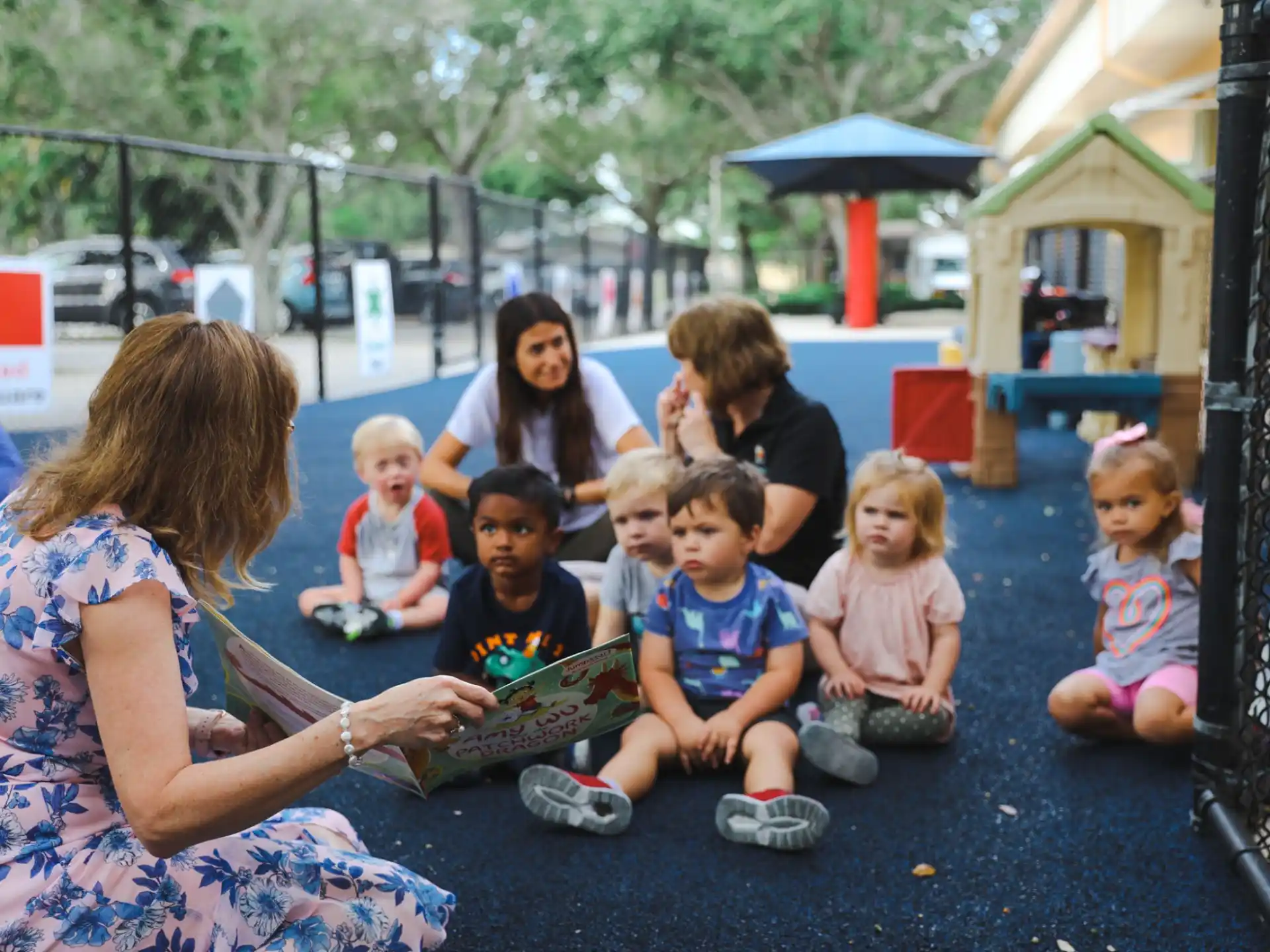 a group of people sitting on the ground