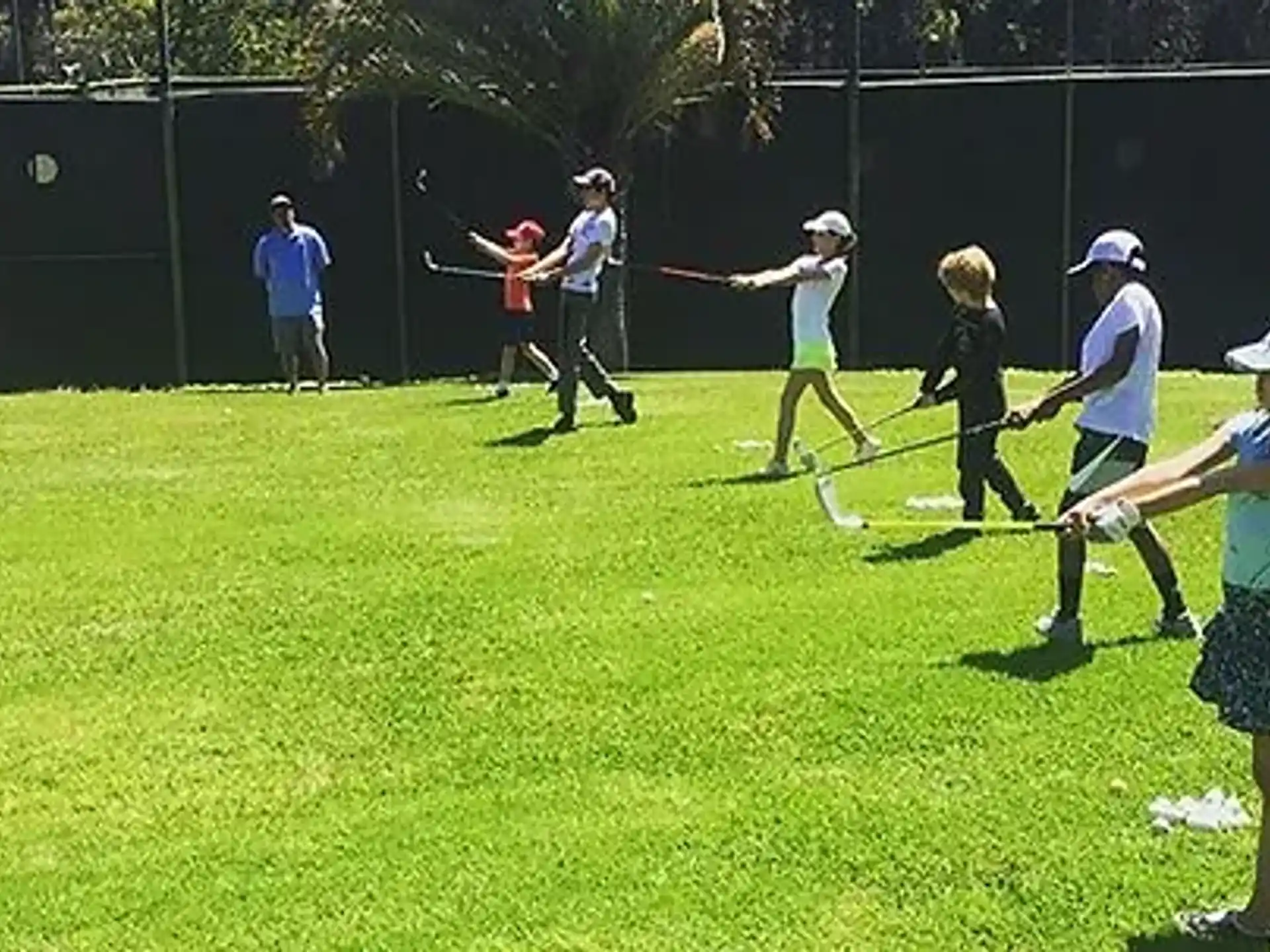 a group of people playing baseball