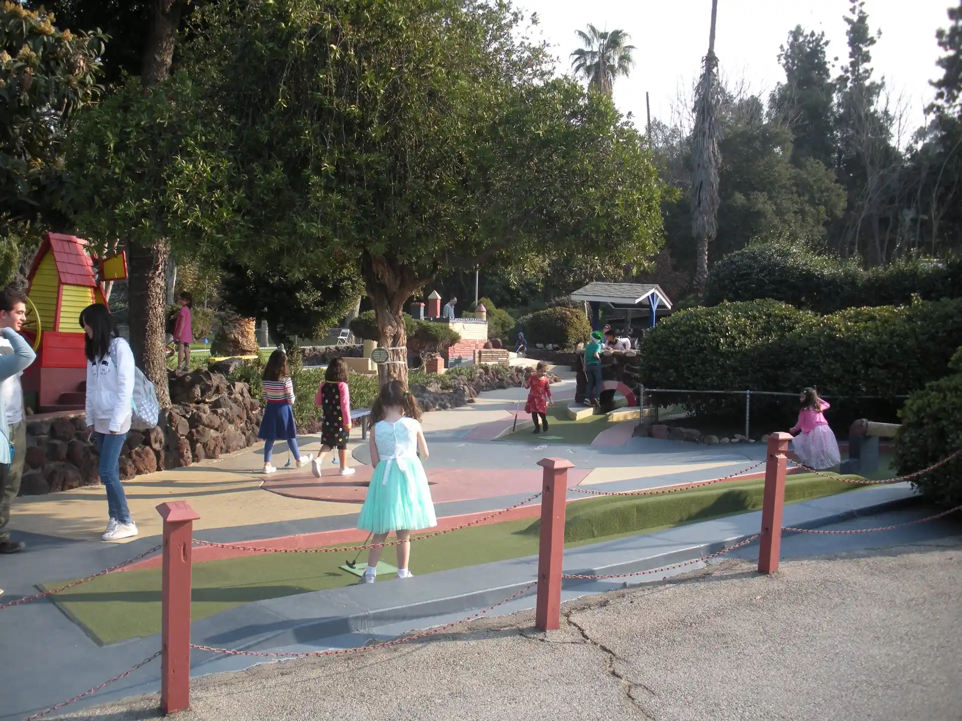 a group of people playing in a park