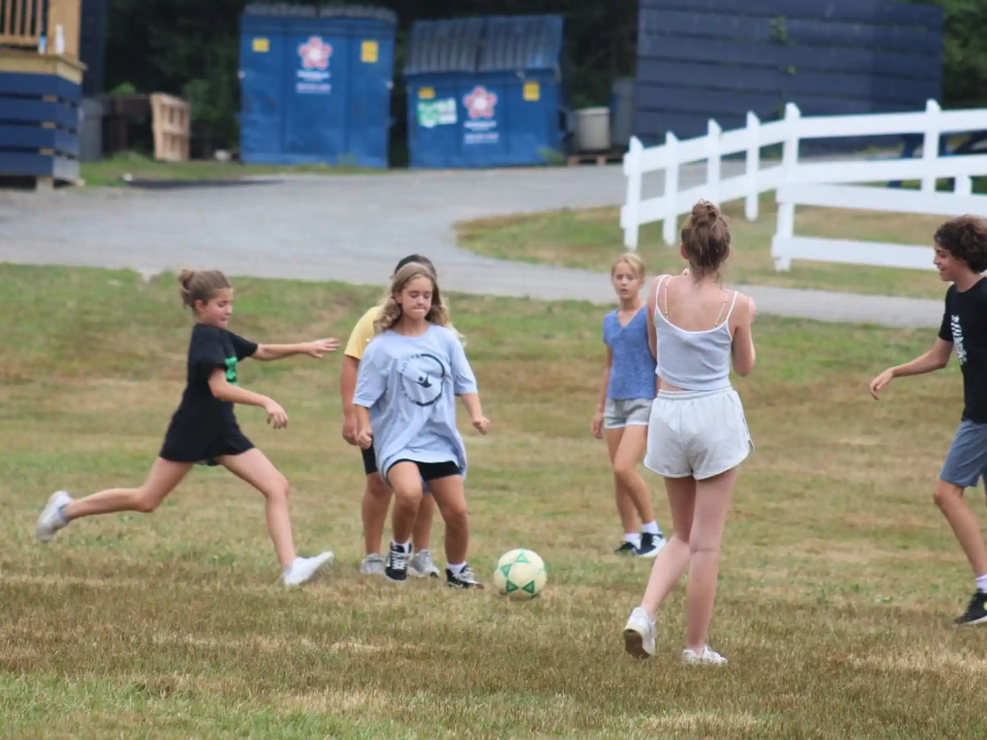 a group of kids playing football