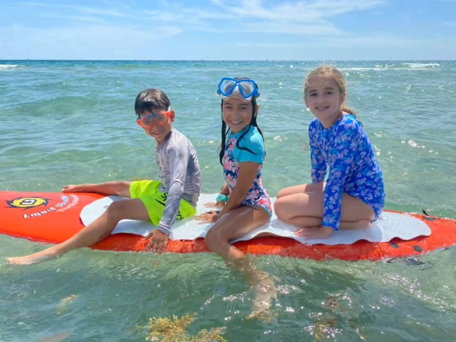 a group of people on a floaty in the water