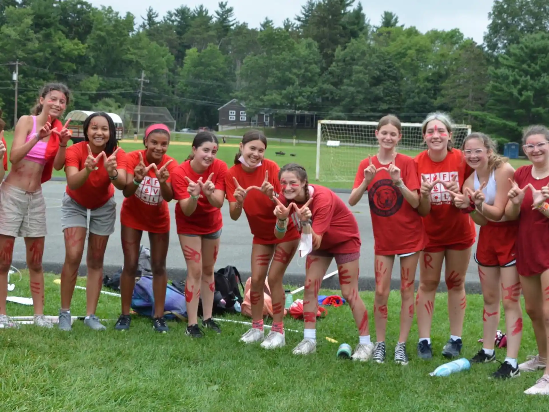 a group of people wearing red shirts