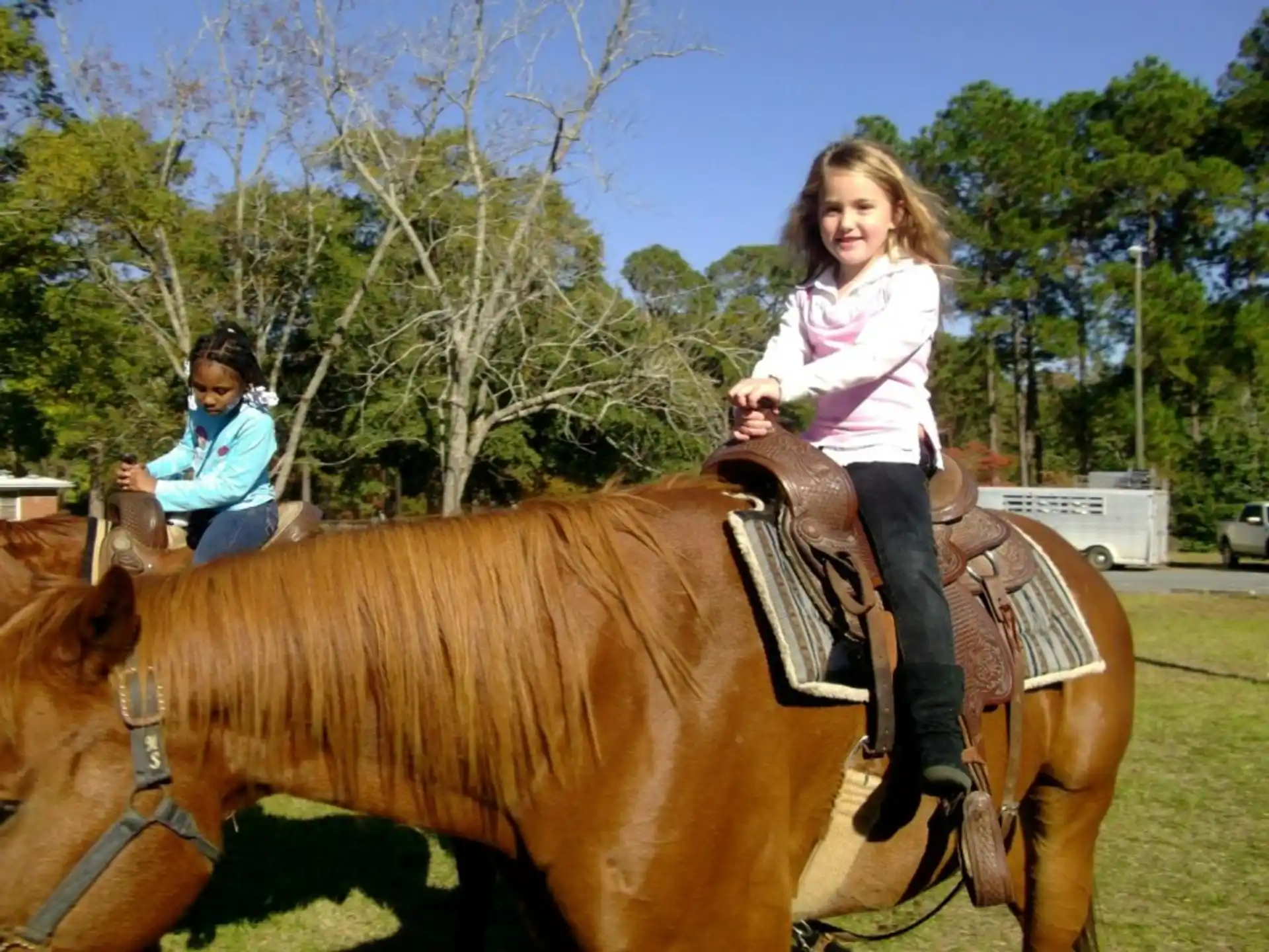 a girl riding a horse