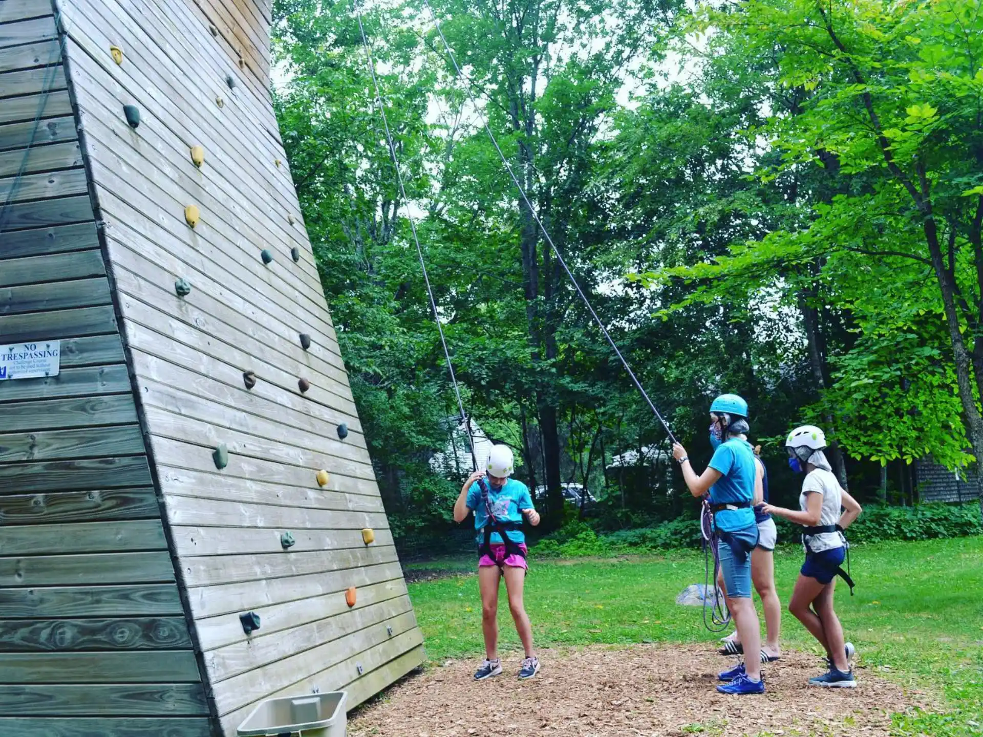 a group of people on a swing set