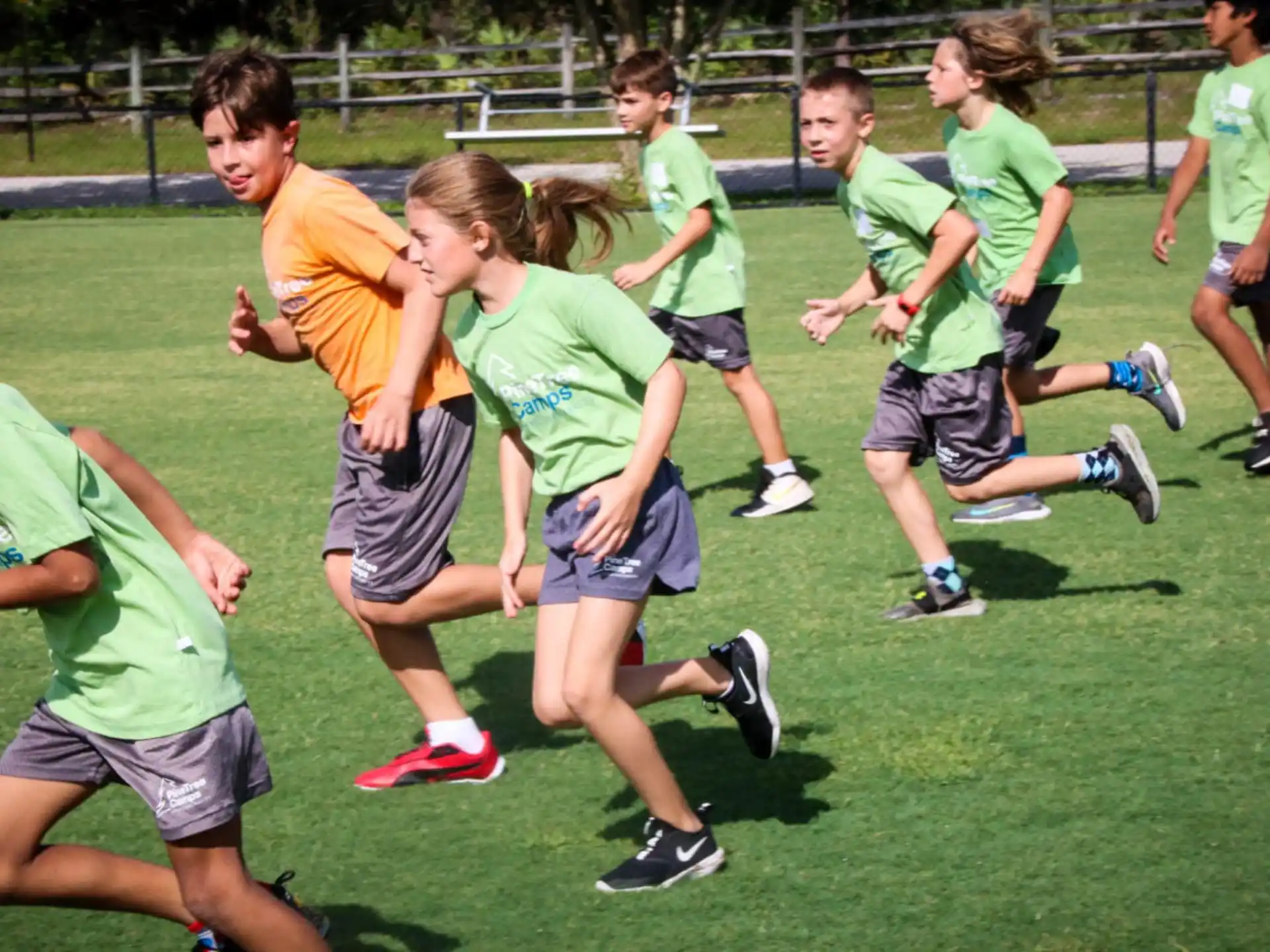 a group of people running on a field