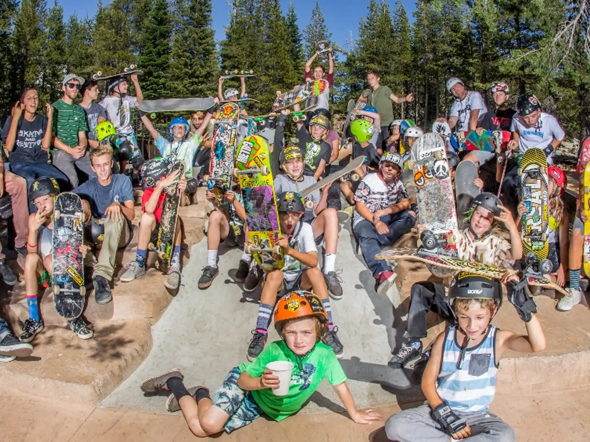 a group of people posing for a photo with their skateboards
