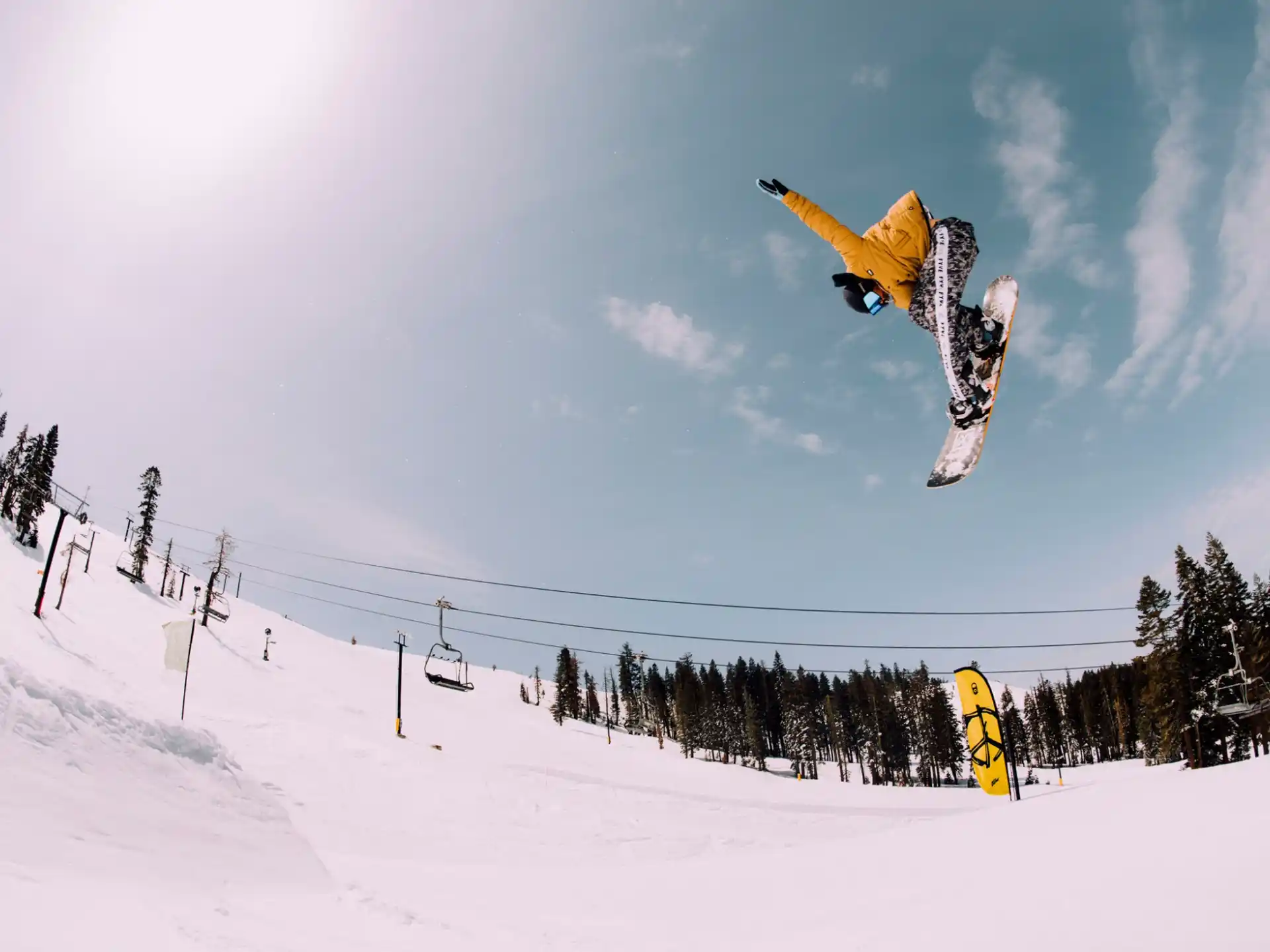 a snowboarder flies through the air