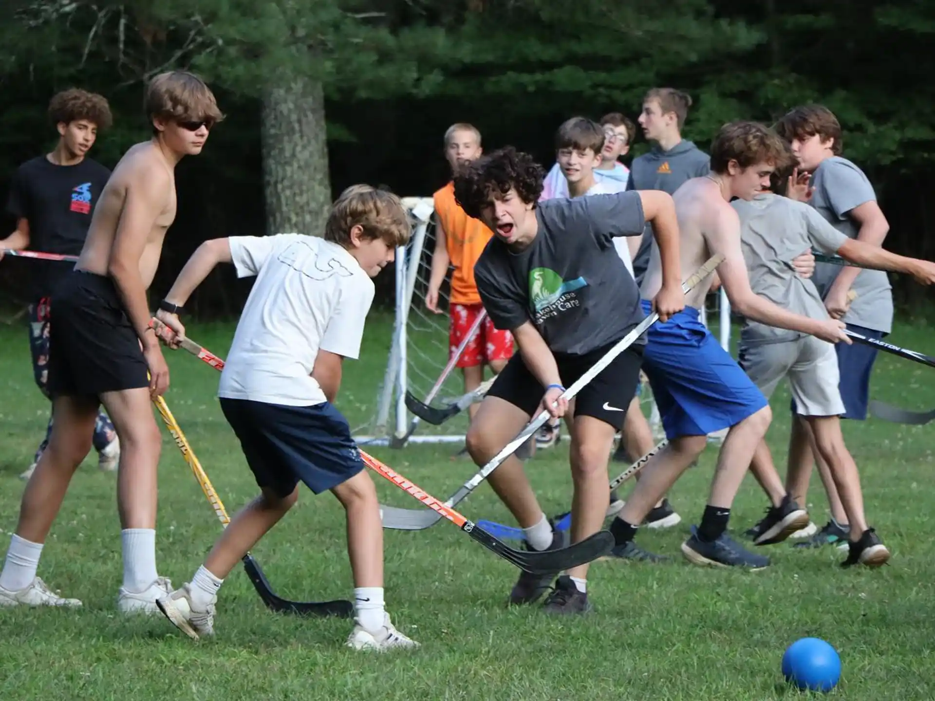 a group of boys playing a game of hockey