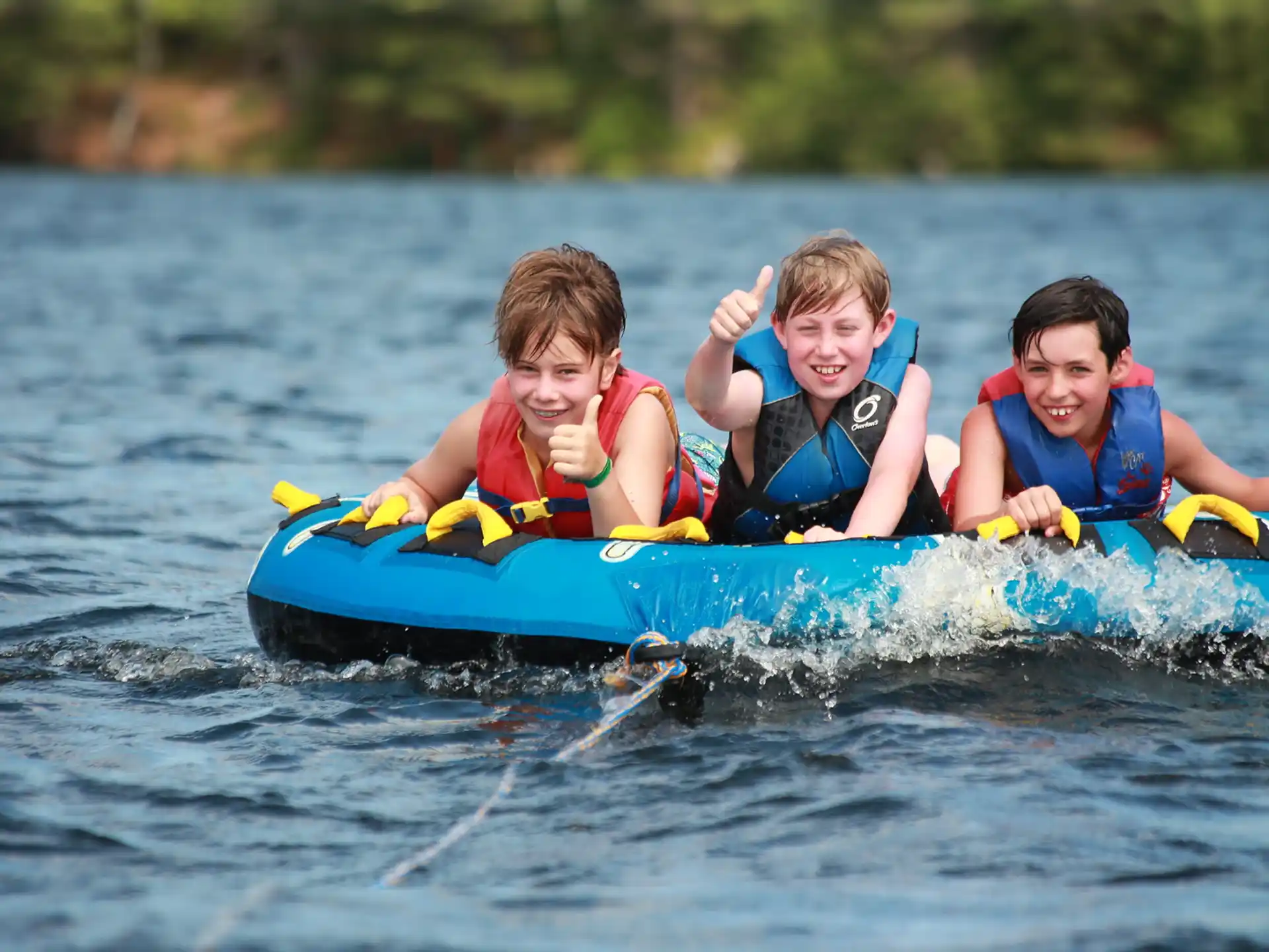 a group of kids on a raft