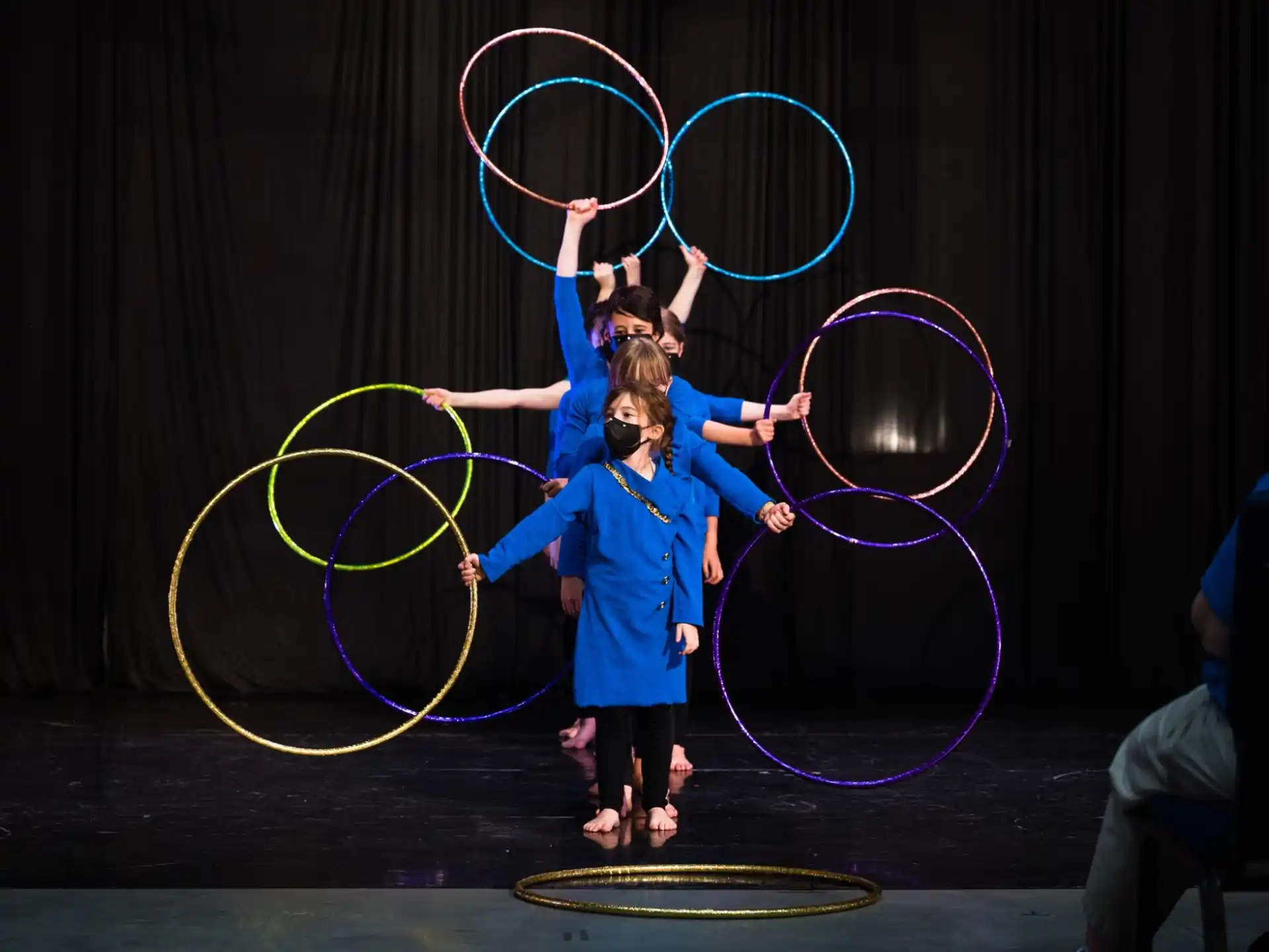 two girls holding hoops