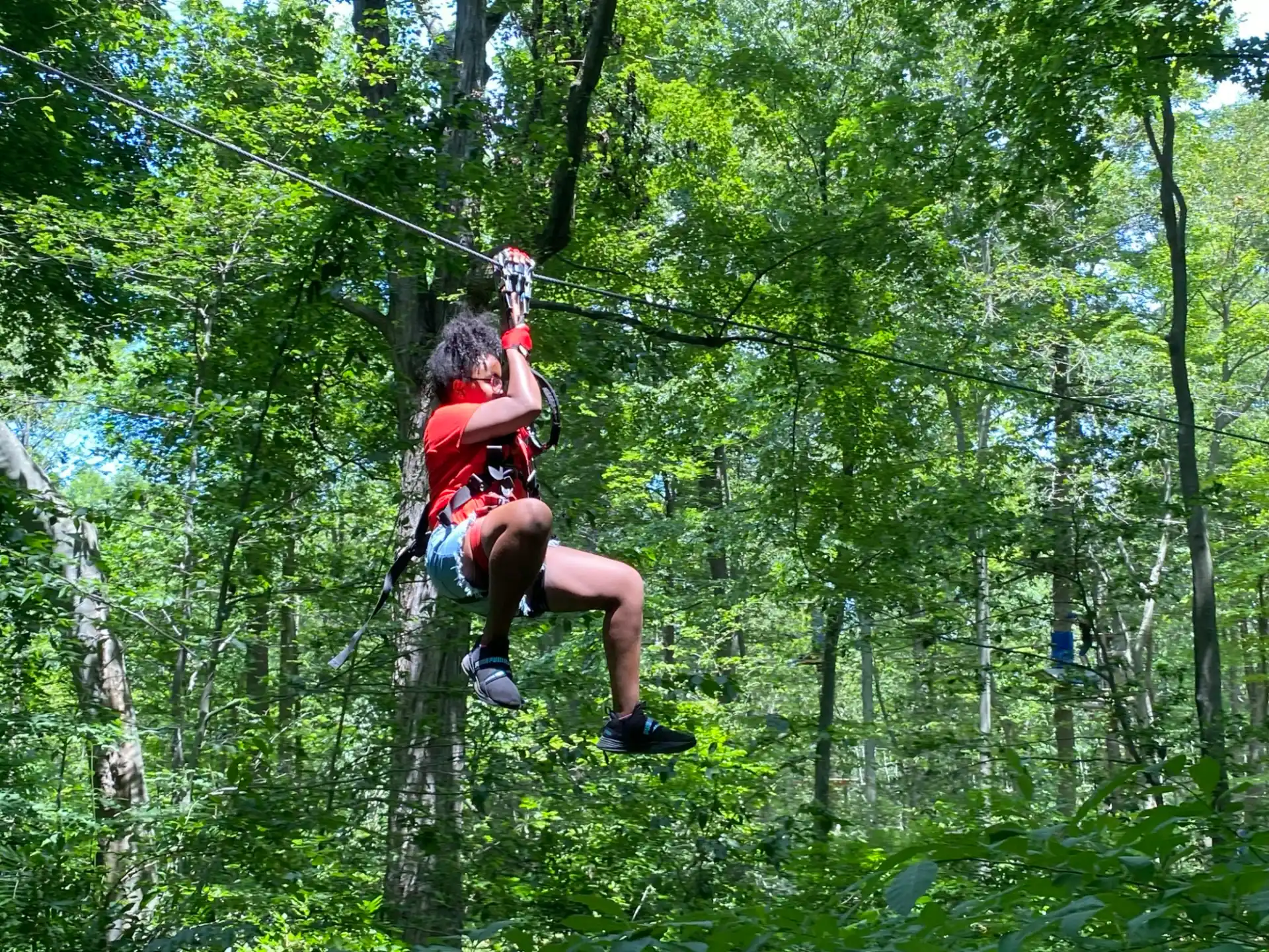 a man on a zip line