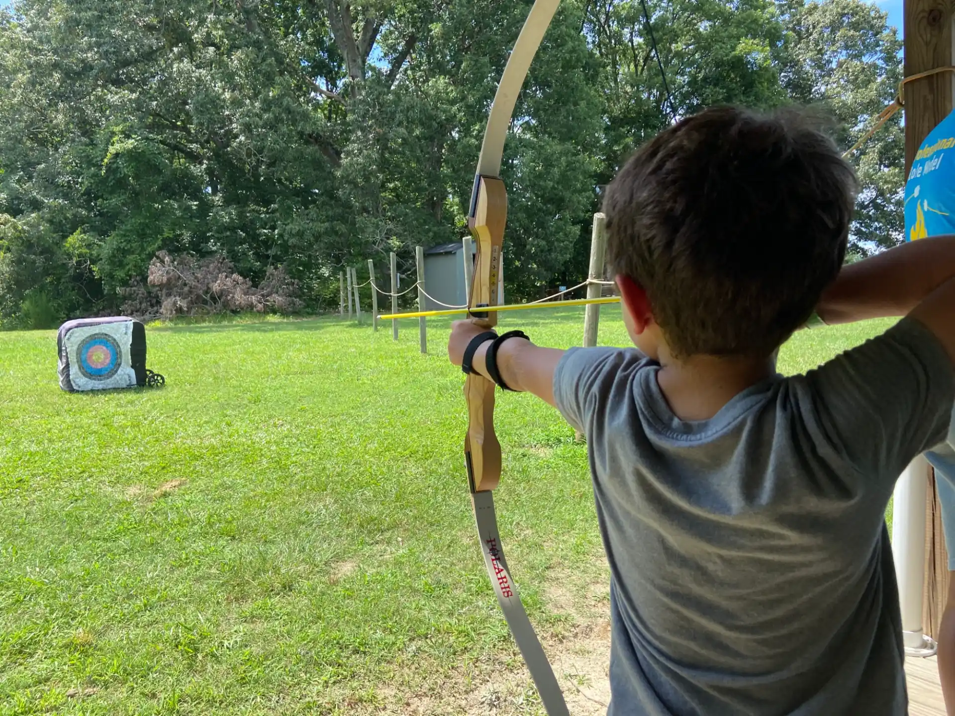 a boy holding a bow and arrow