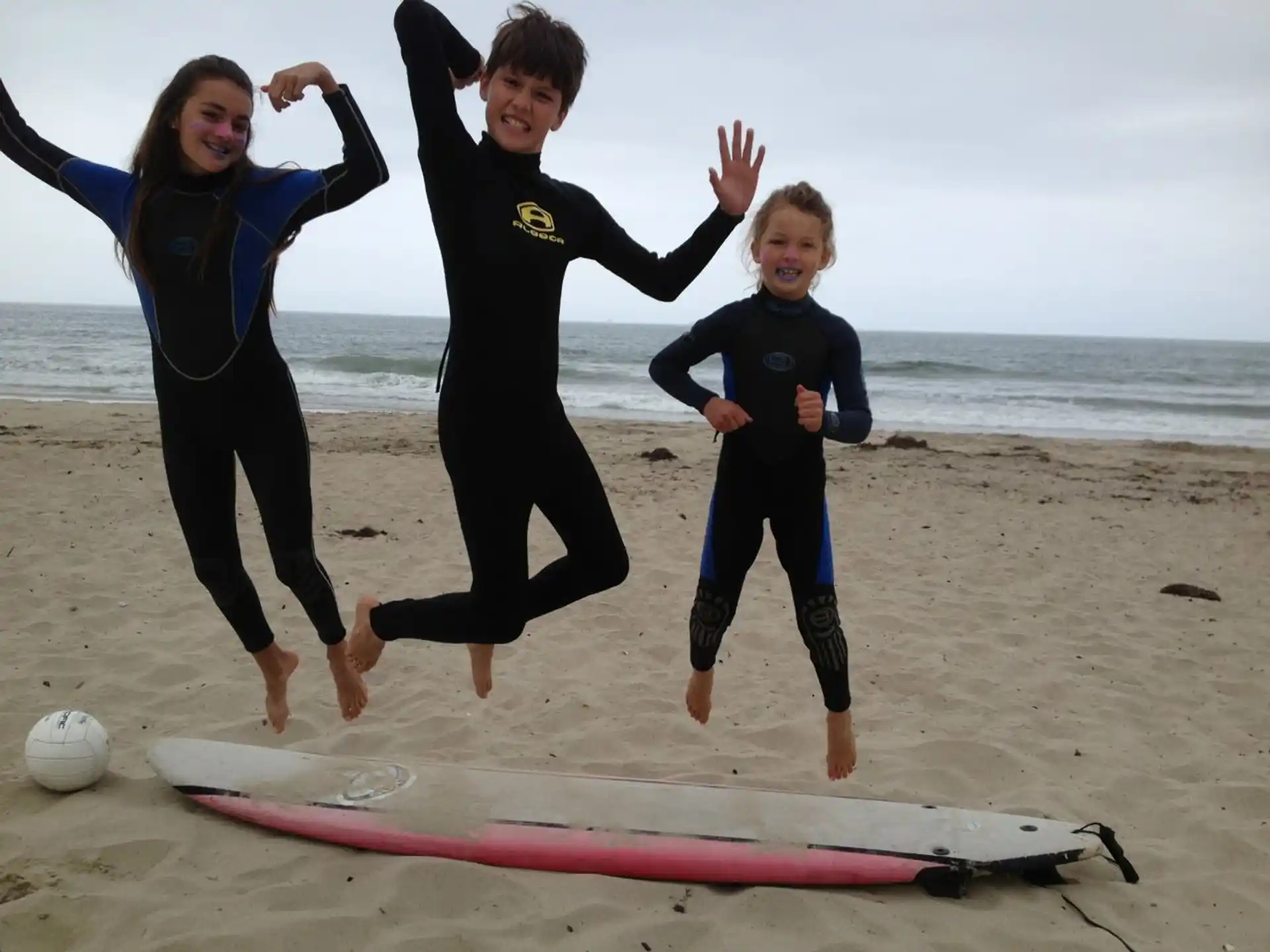 a group of kids on a beach