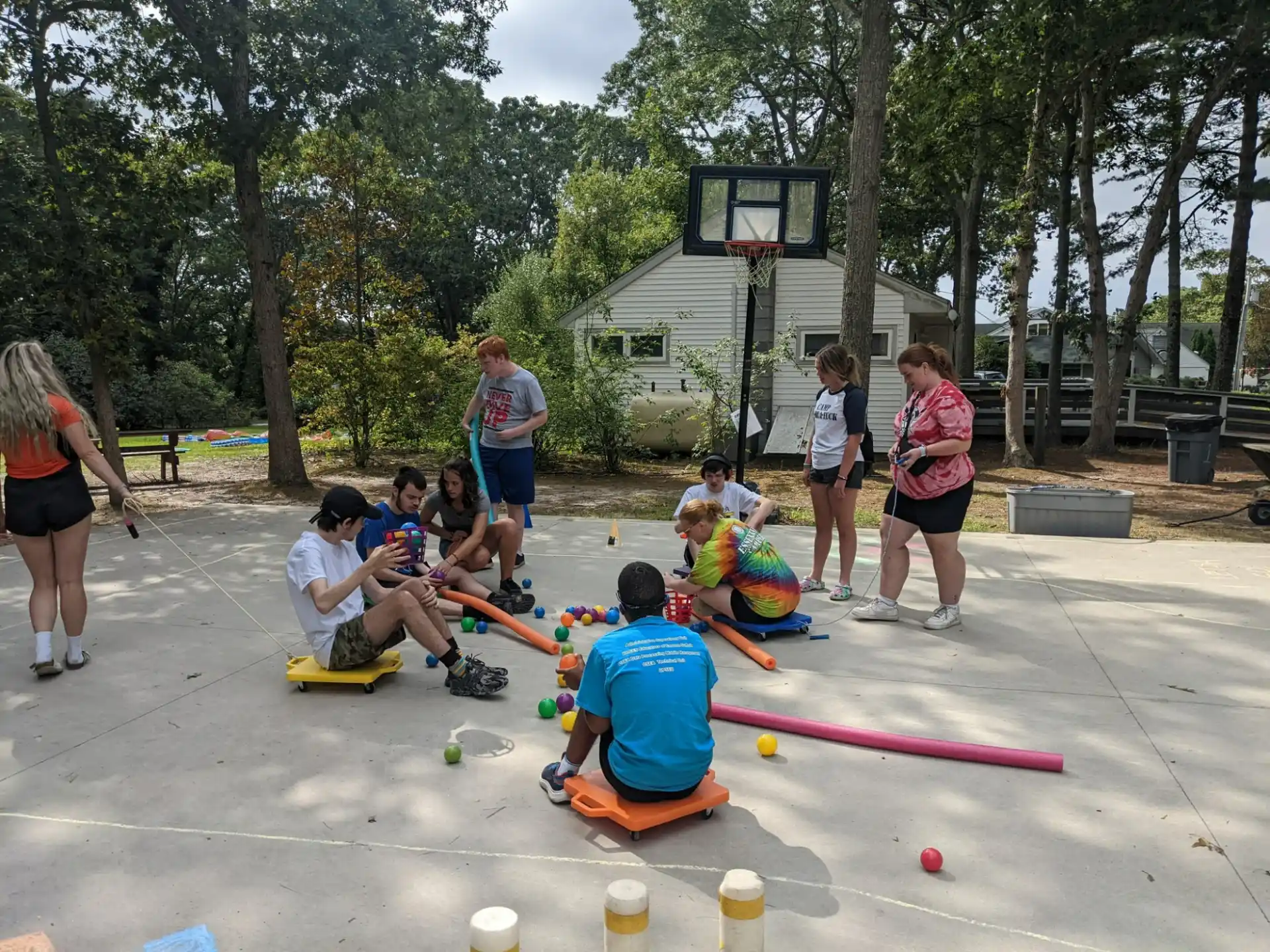 a group of people playing with toy