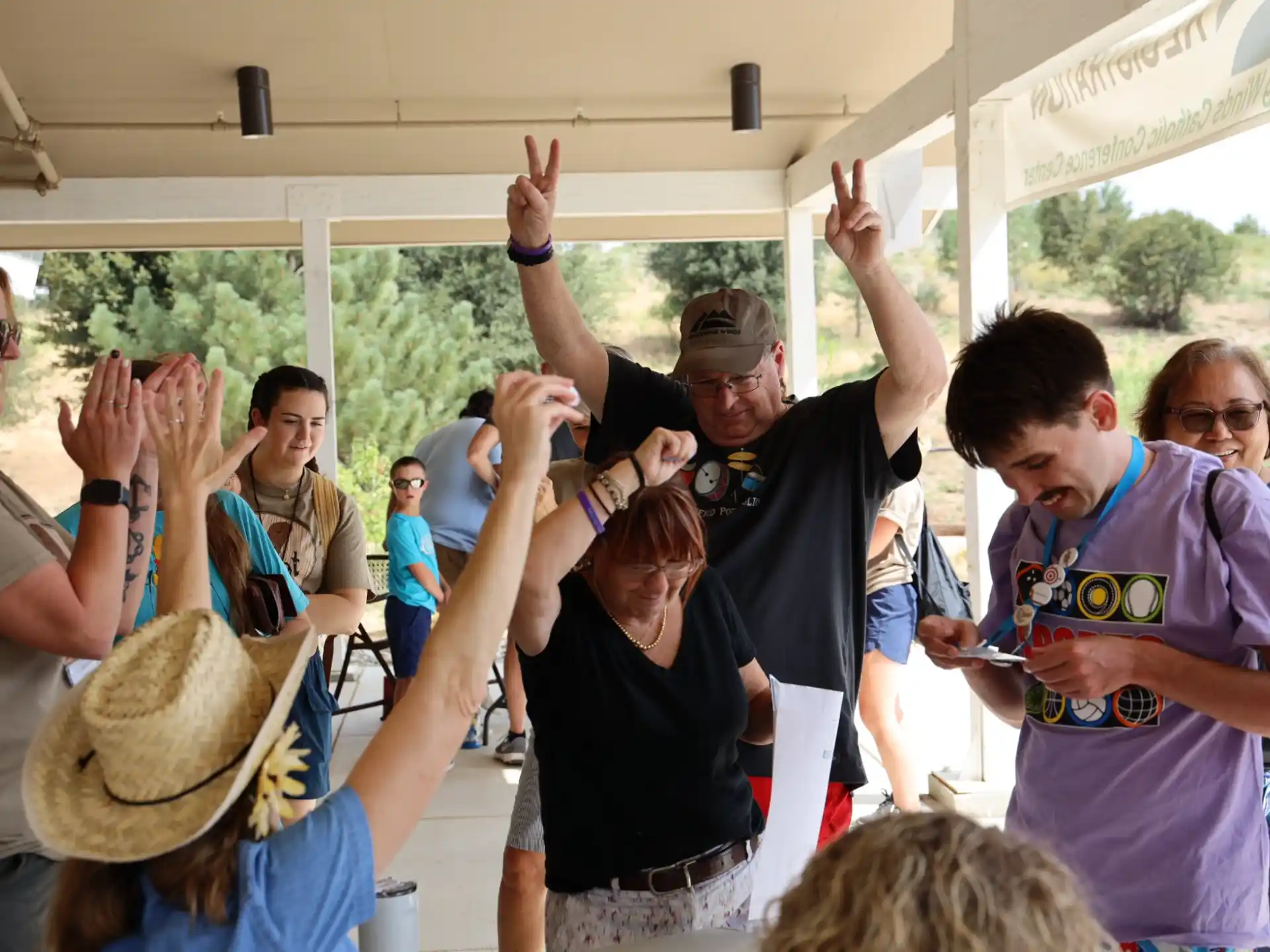 a group of people raising their hands
