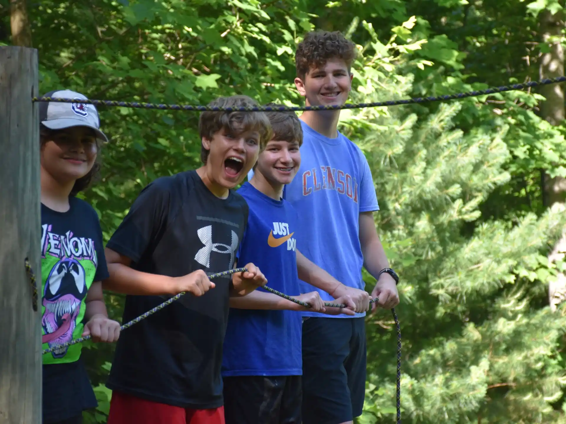 a group of boys holding a fish