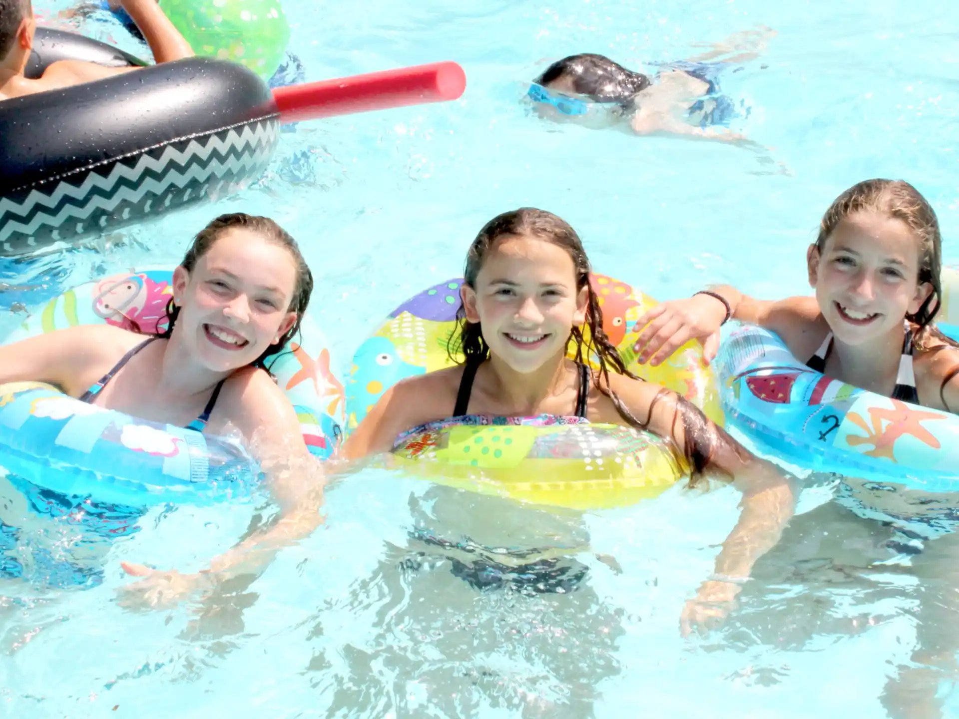 a group of girls in a pool