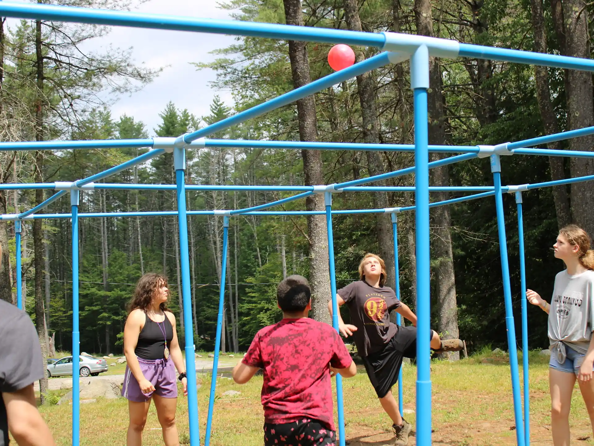 a group of people playing volleyball
