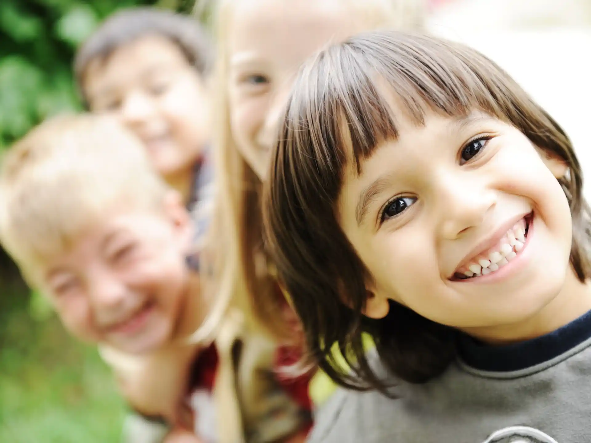 a close-up of a young girl smiling