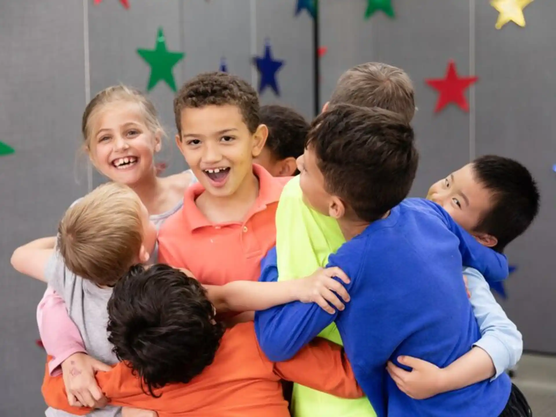 a group of children hugging