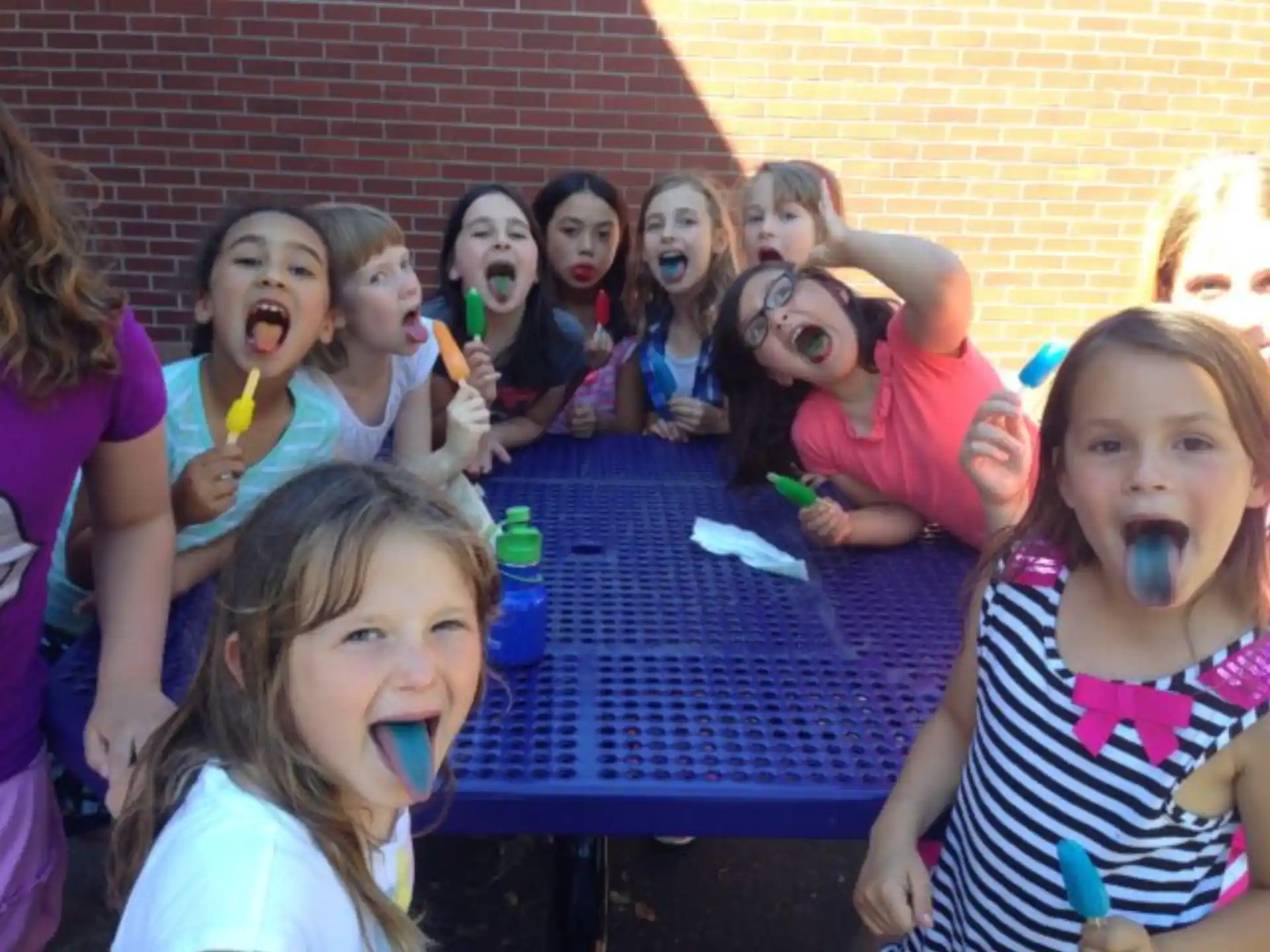 a group of children with their mouths open