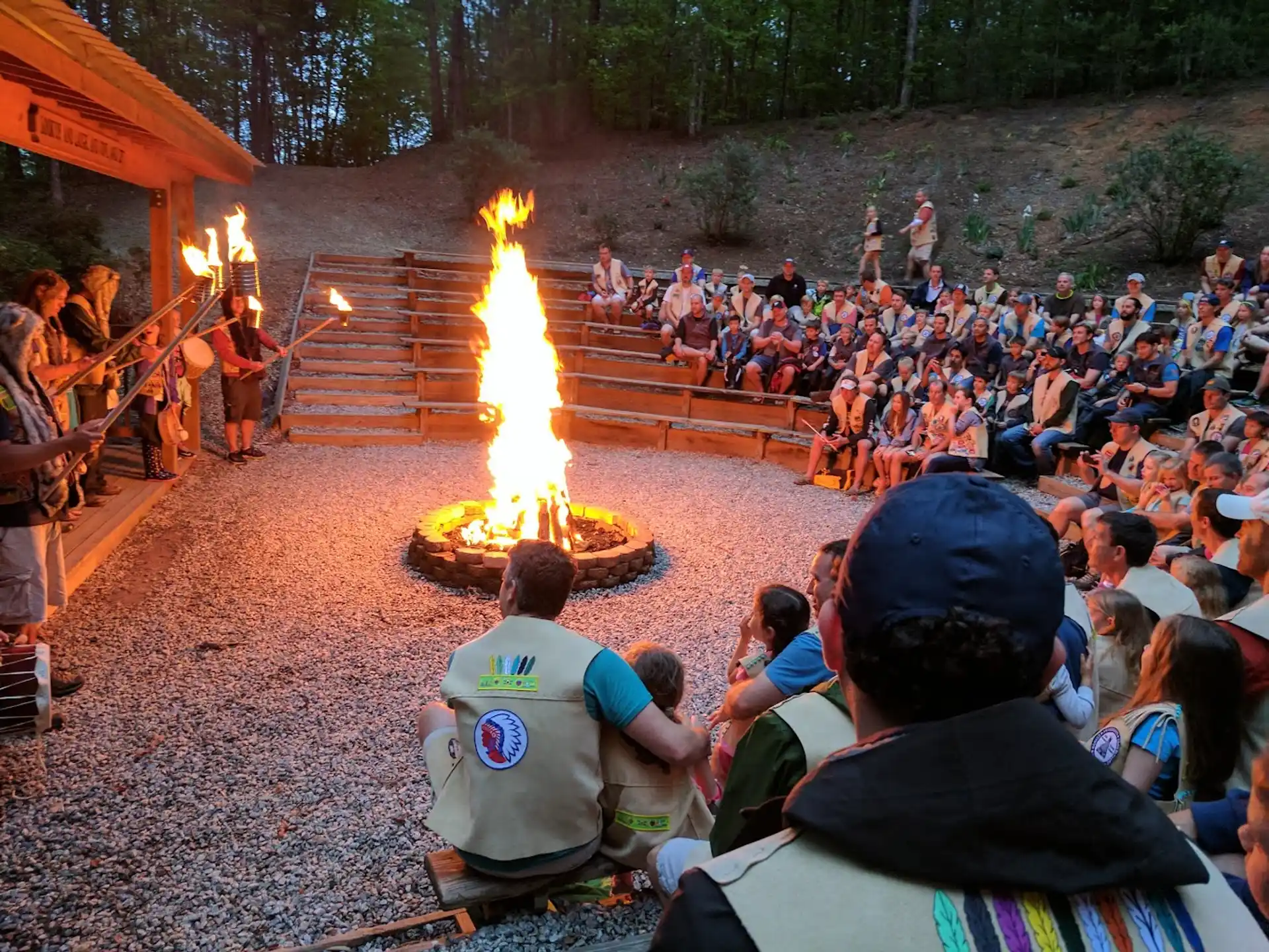 a group of people around a fire