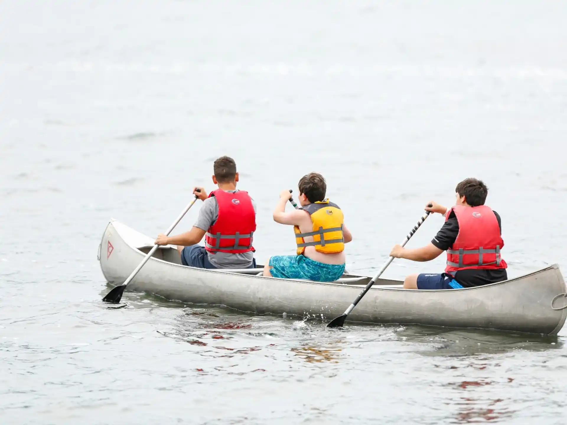 a group of people in a canoe