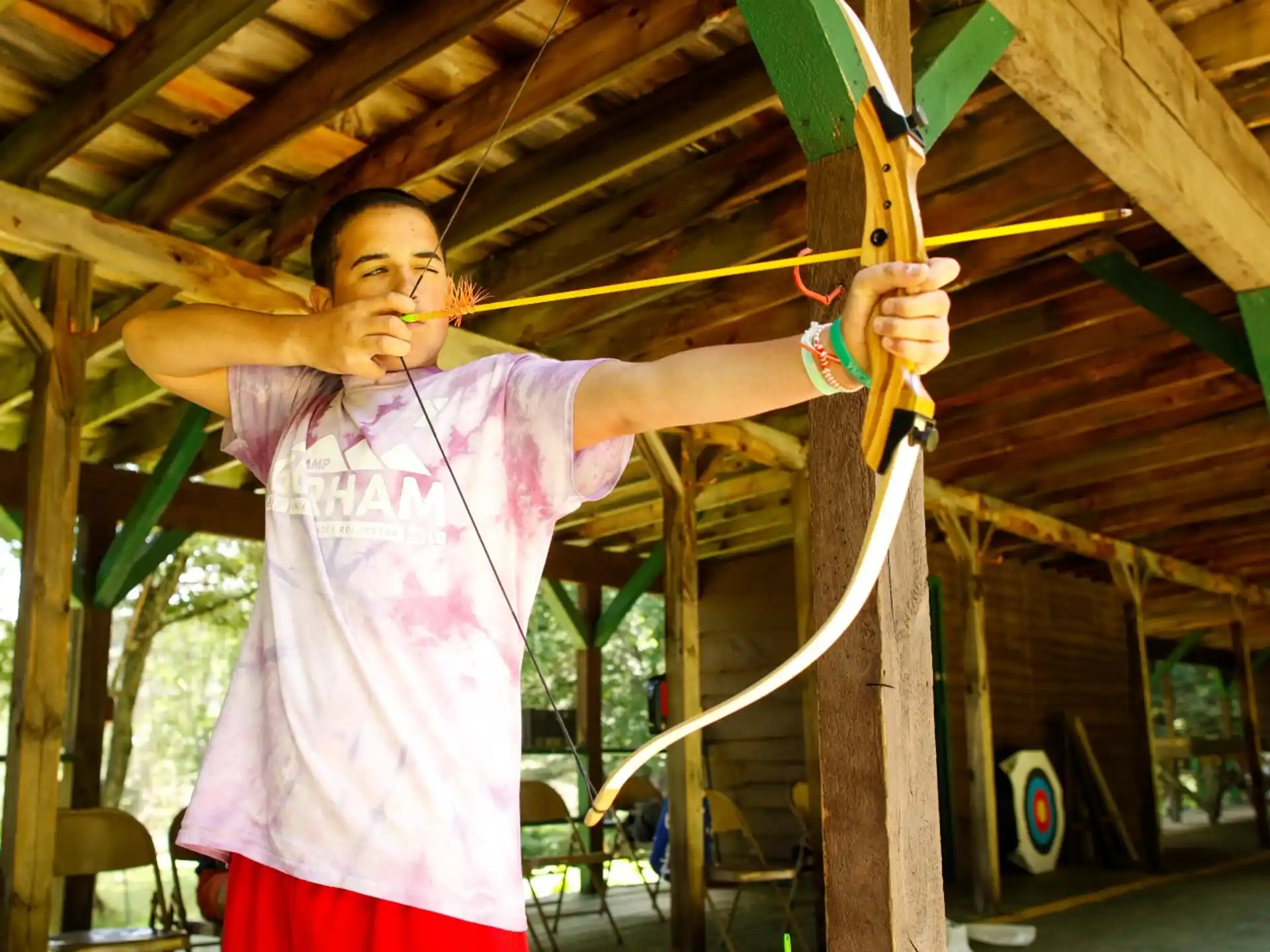 a person holding a large wooden pole