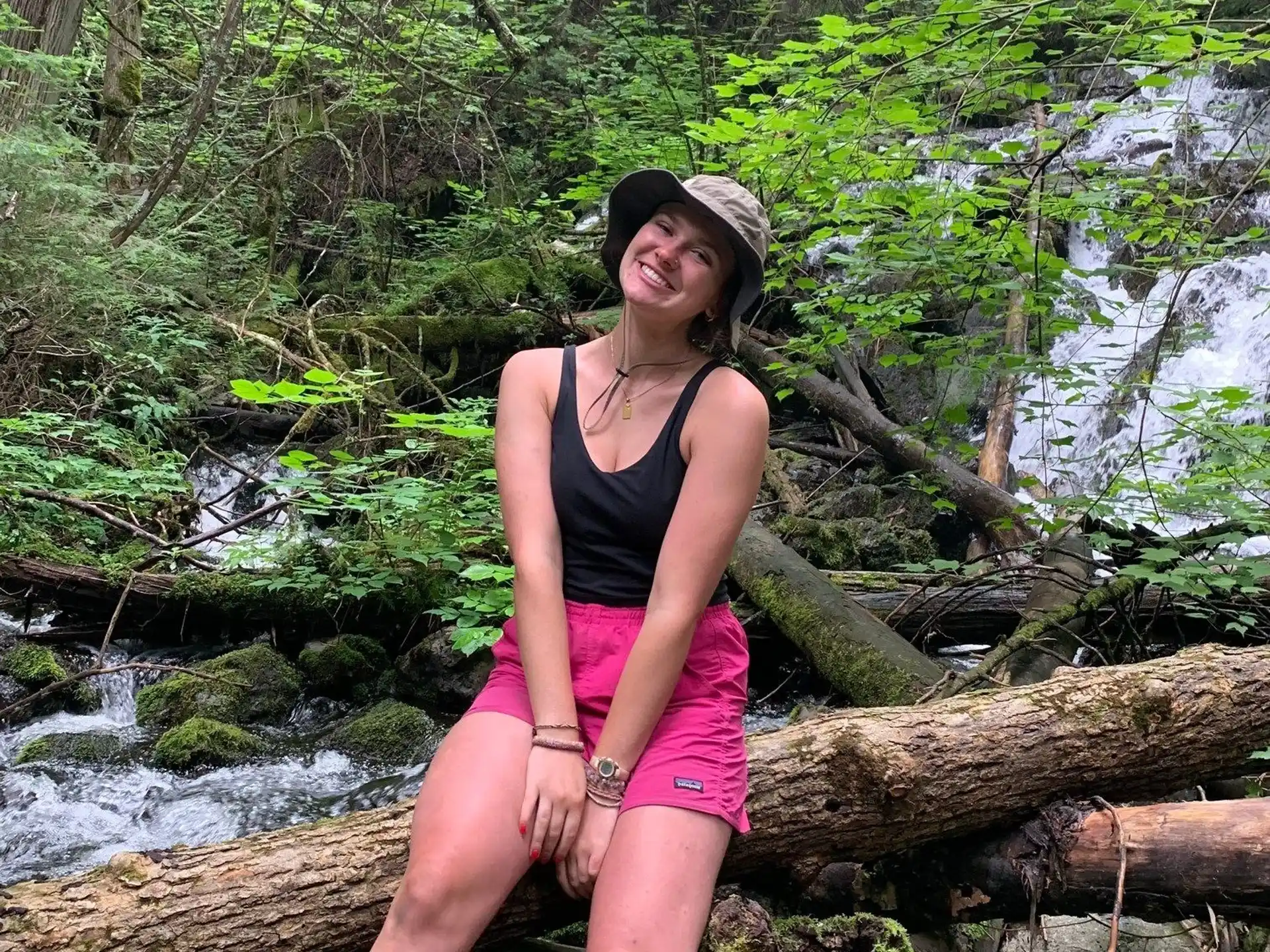 a woman standing on a log