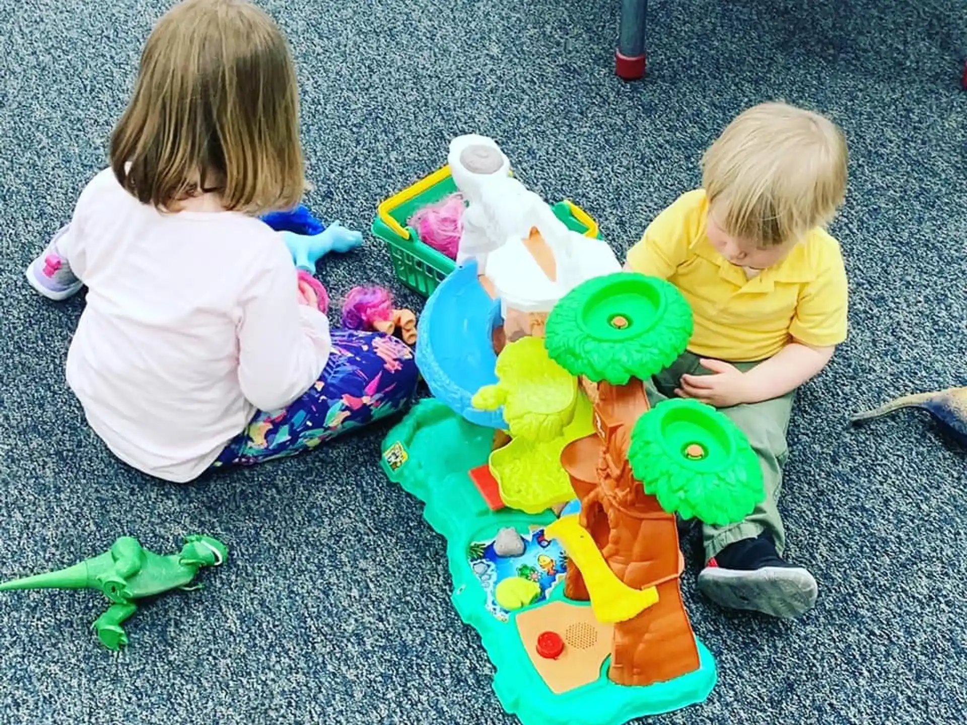 two children playing with toys