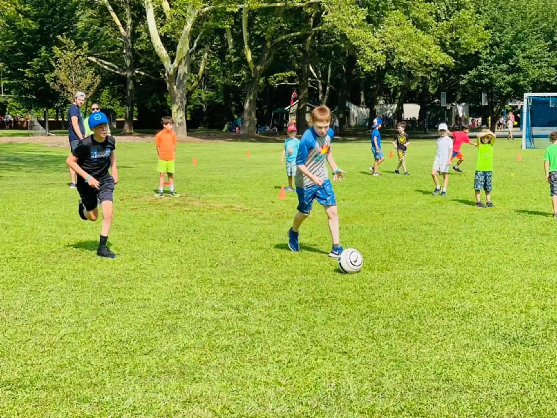 kids playing football in a field