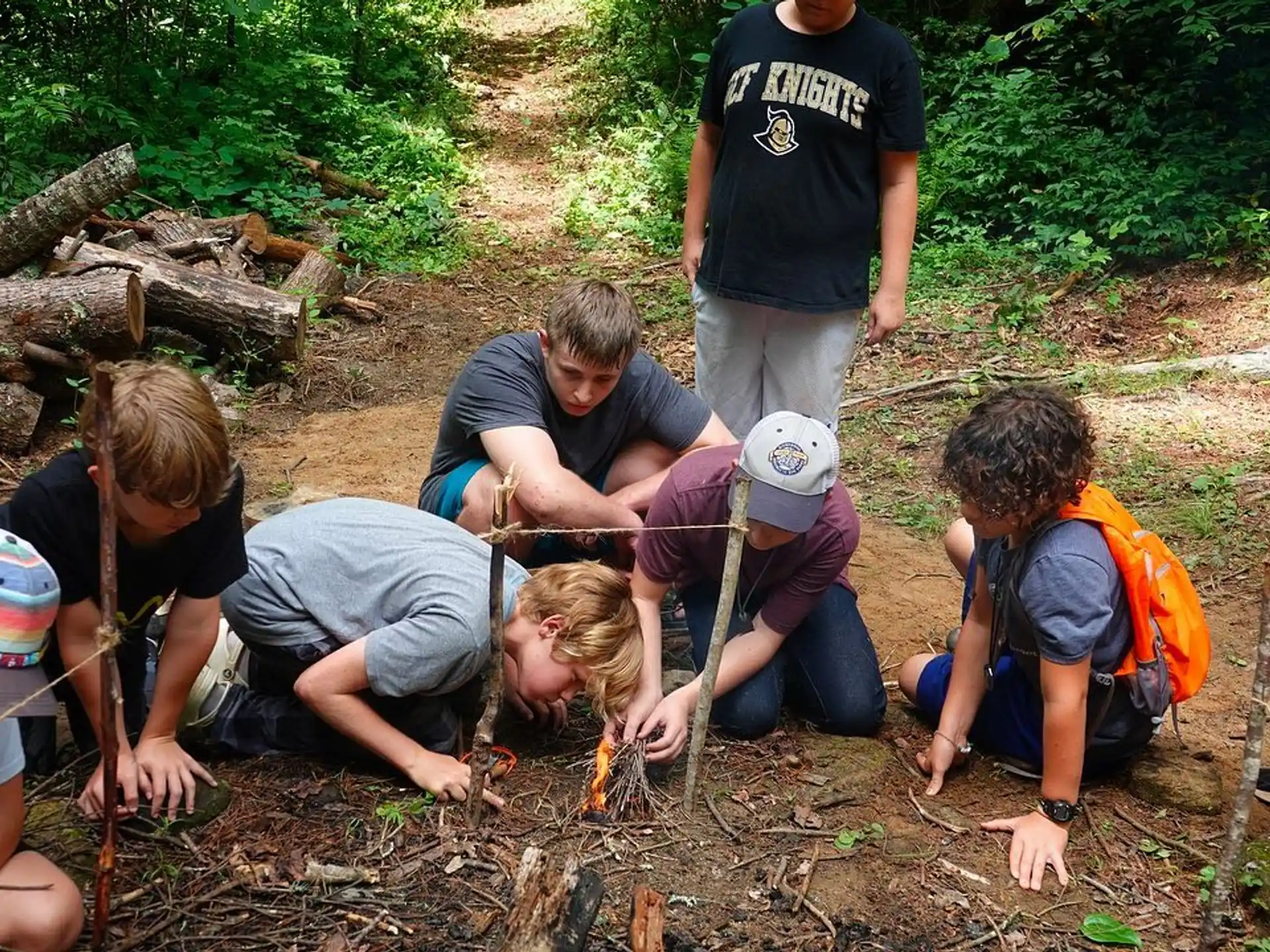 a group of people digging in the dirt